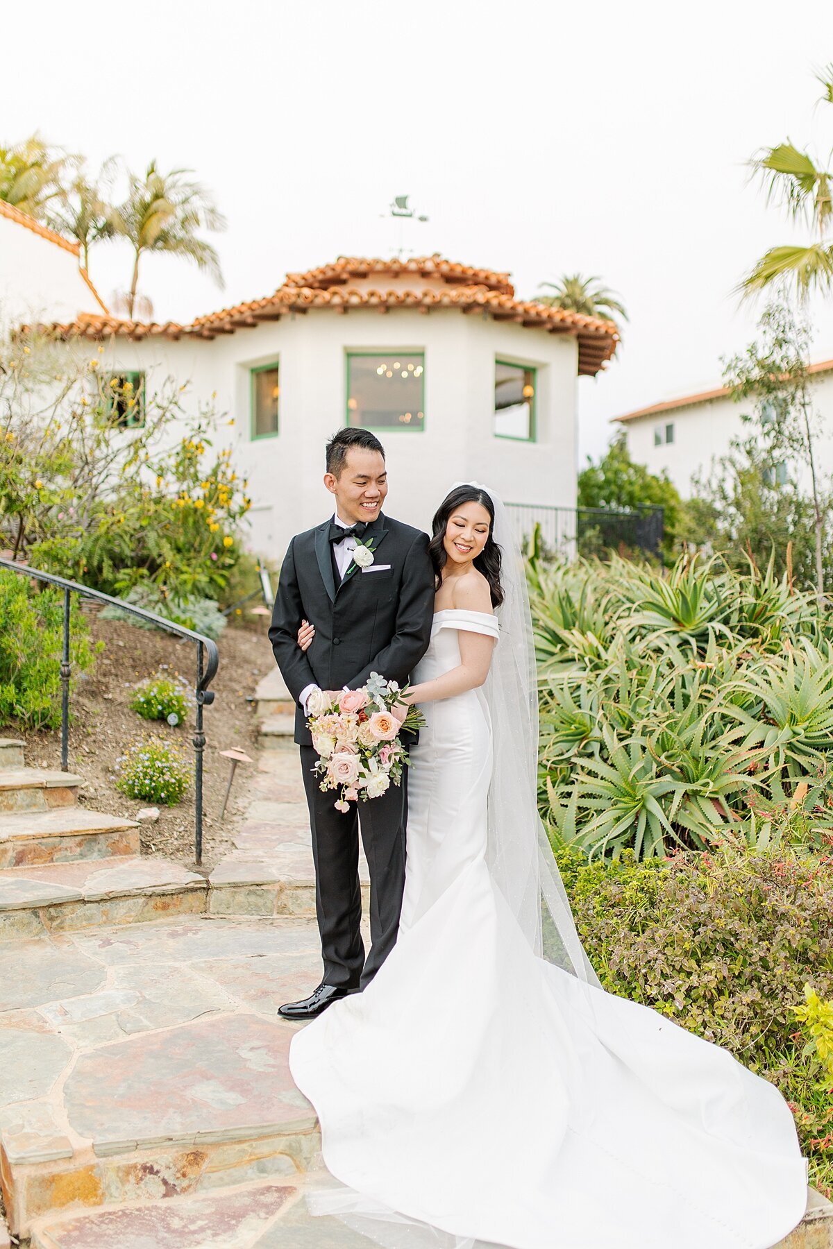 Bride and groom outside Casa Romantica in San Clemente in Orange County, California.