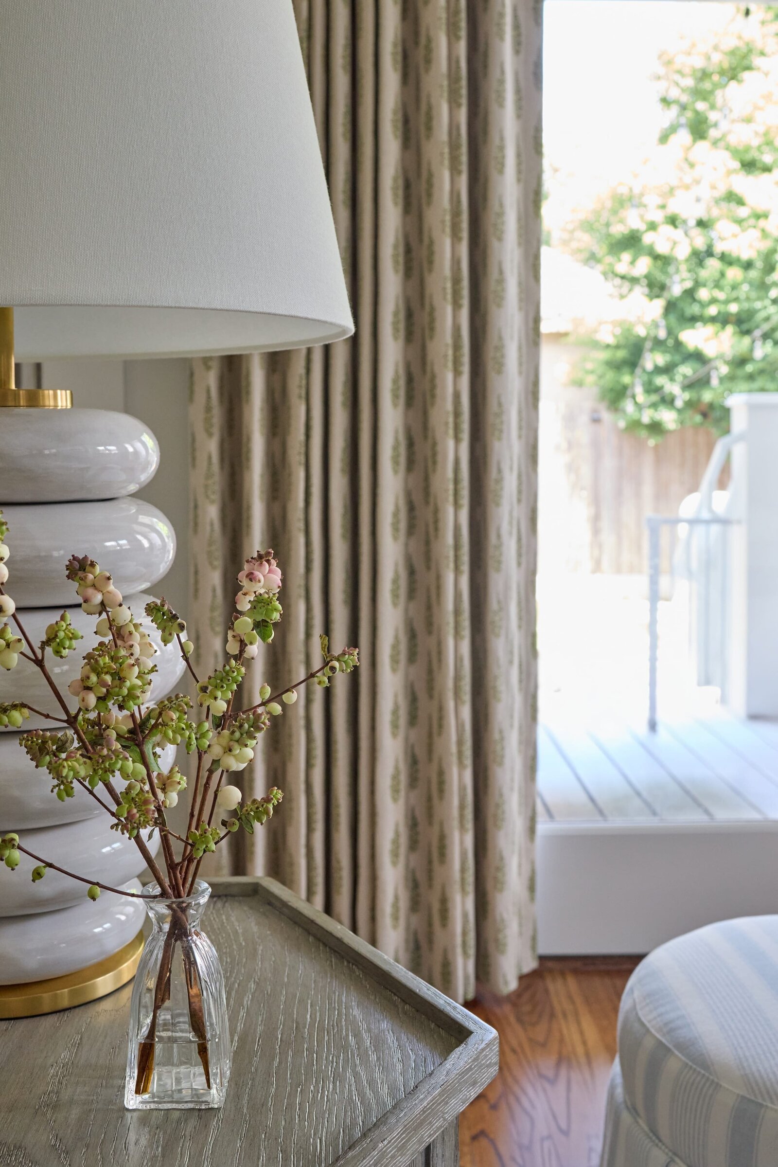 vision and hammer living room side table with glass vase and berry florals