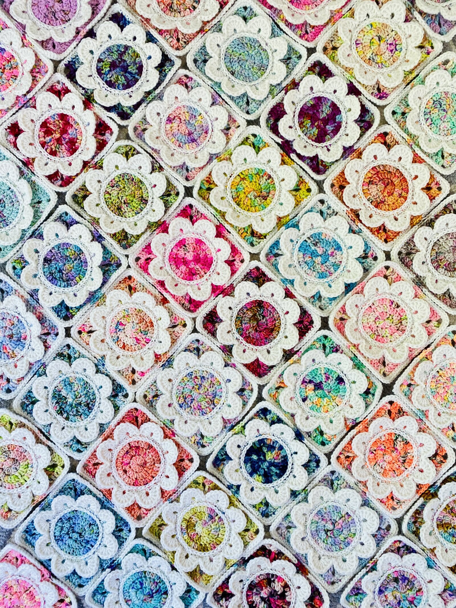 Colorful crocheted floral granny squares.