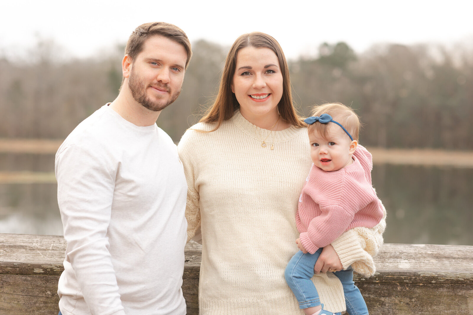 Family looking and smiling at the camera during their morning session in Savannah, Ga