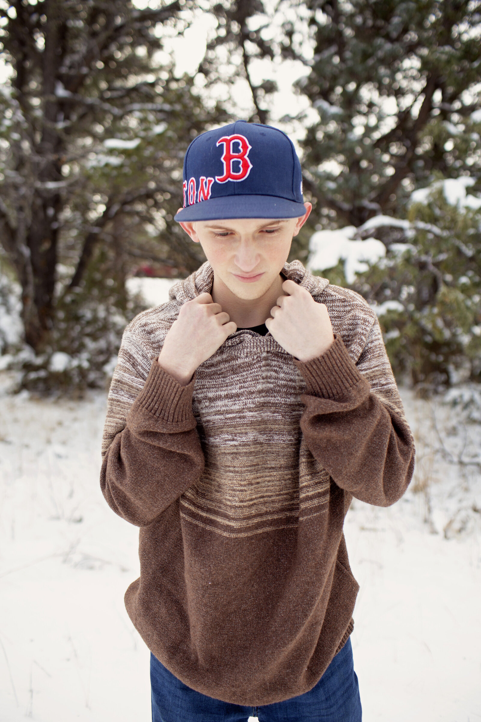 Red-Sox-Senior-Boy-Photo-Session-in-the-snow