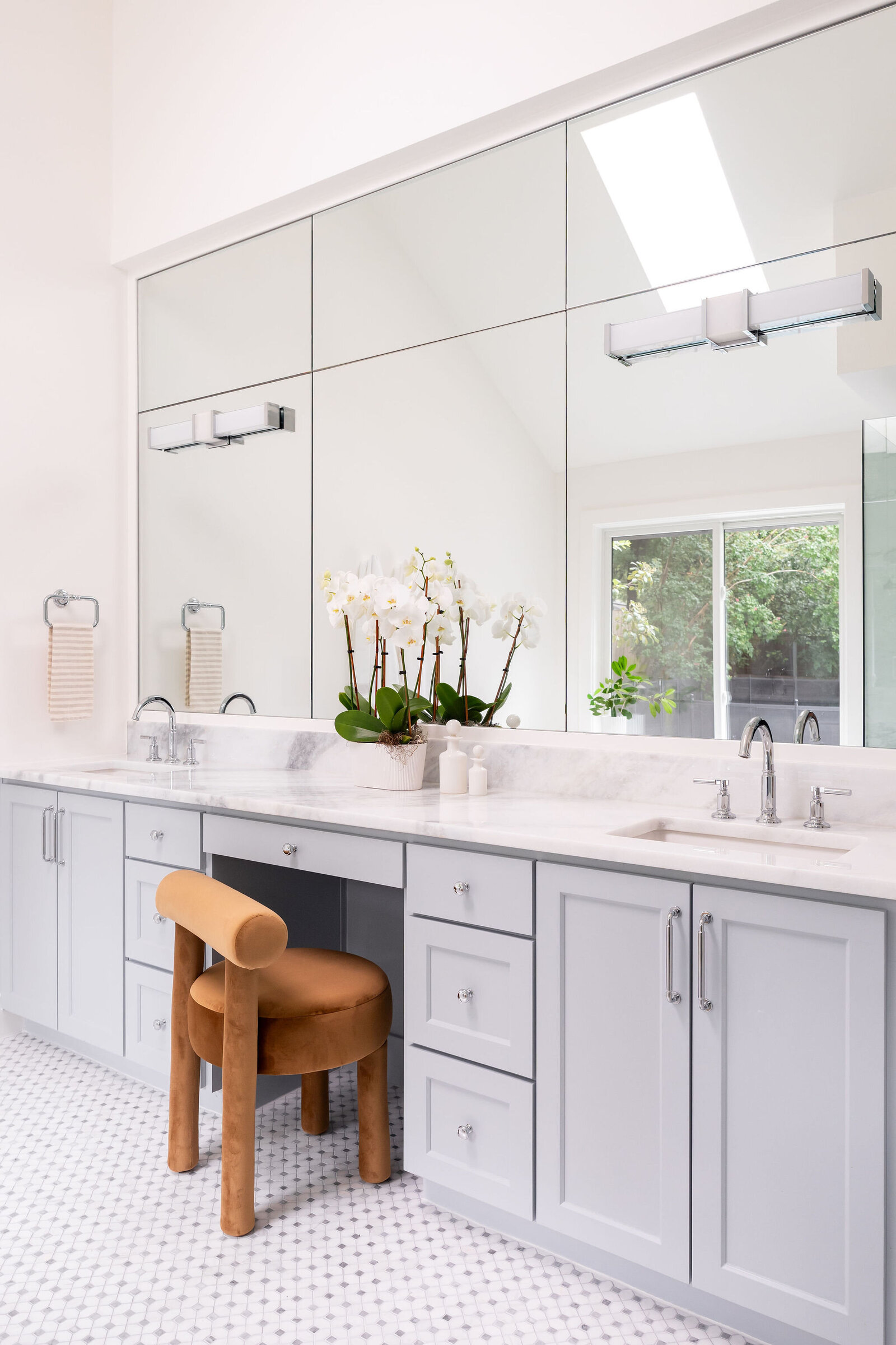 Nuela Designs Primary Bathroom with Custom Mirror and Quartzite Countertops