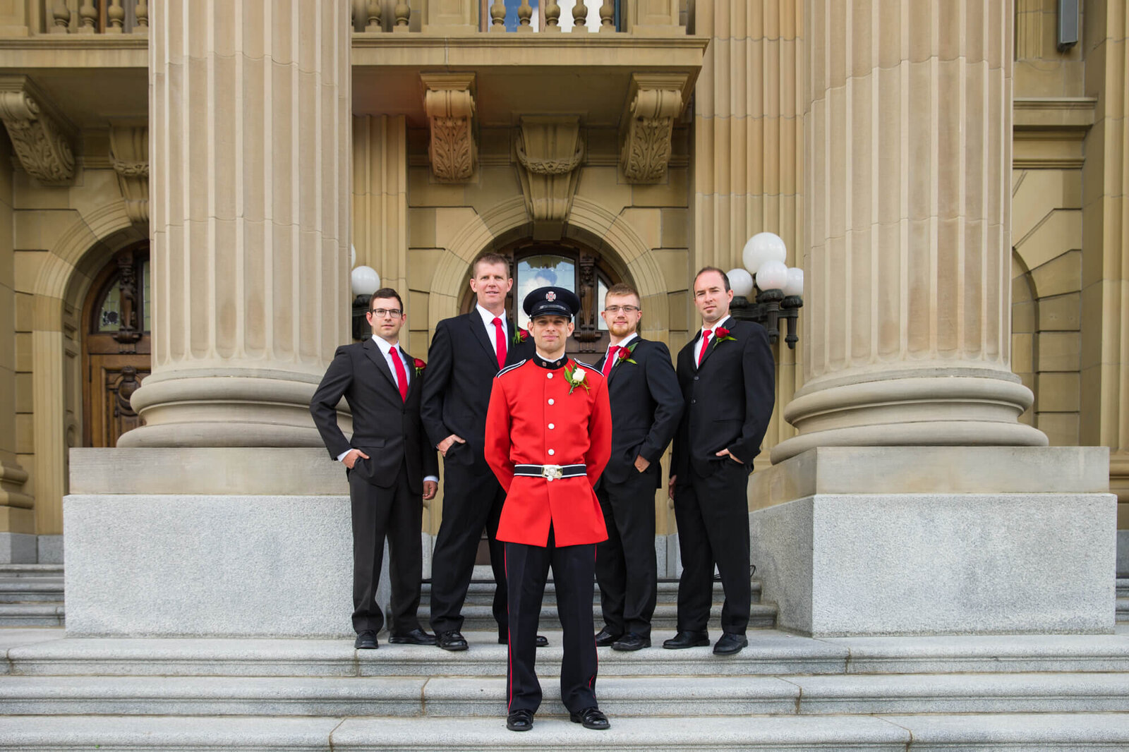 RCMP groom posed with groomsmen at Alberta Legislative Building