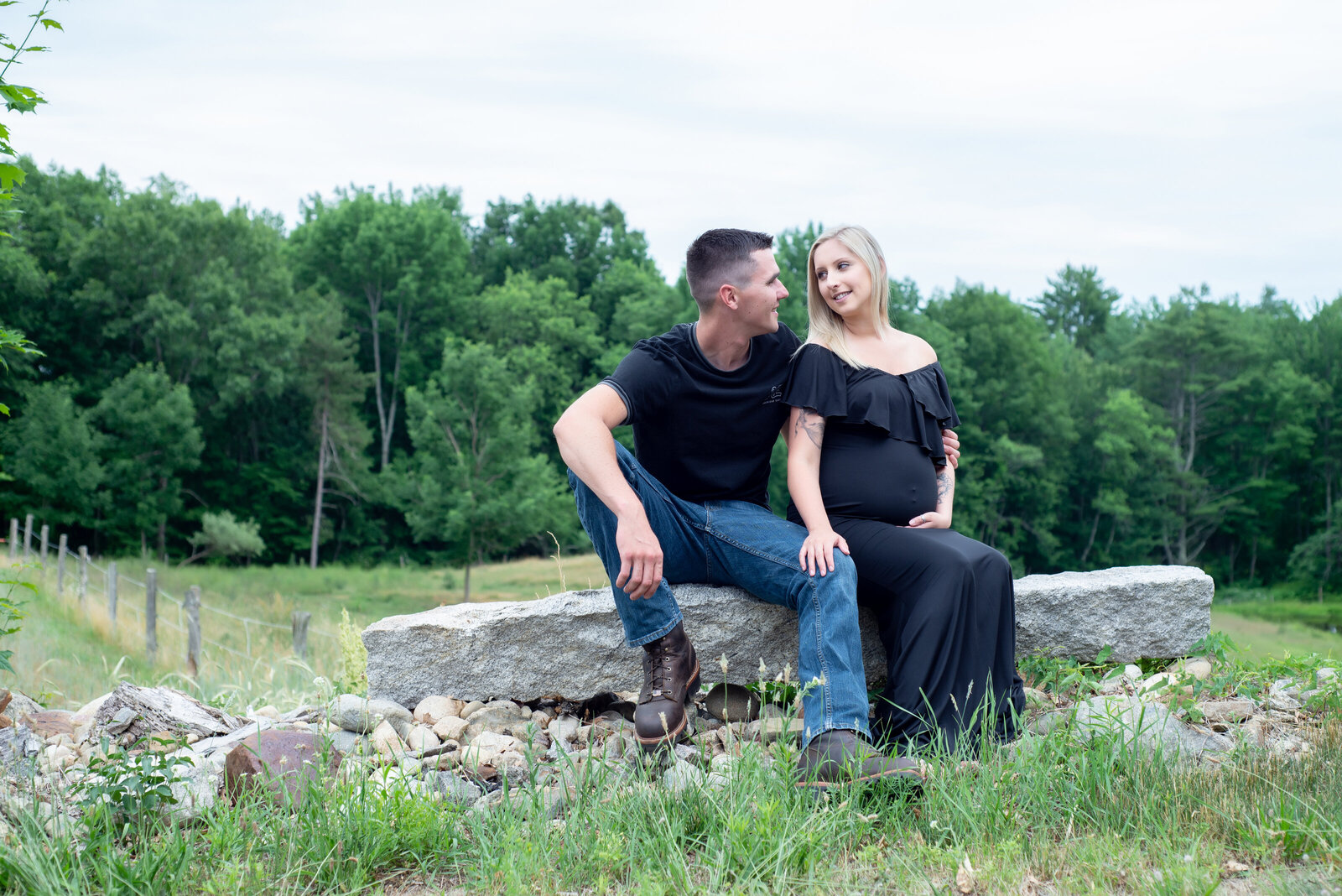 Couple in maternity photo in country setting