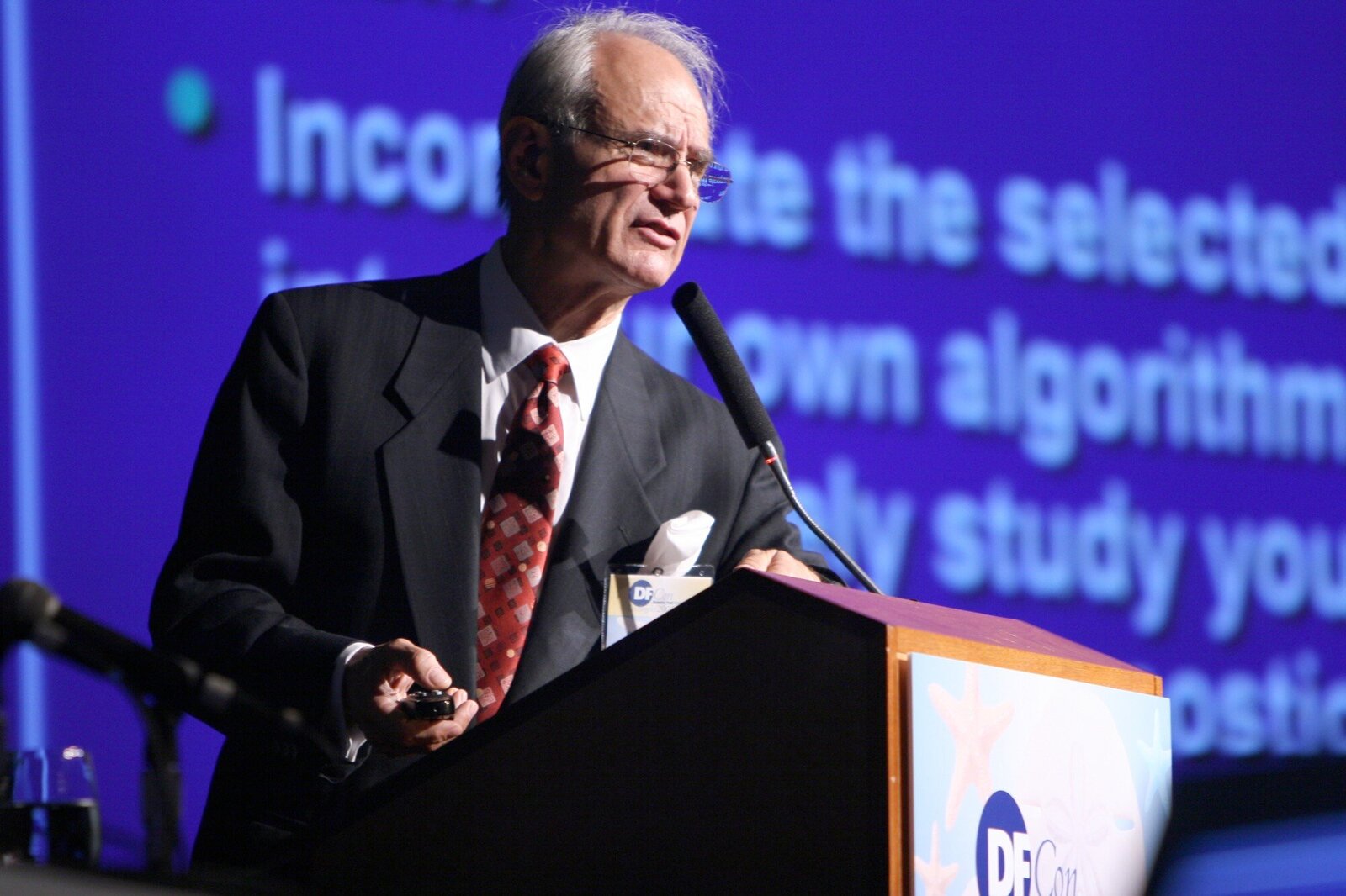 Presenter giving talk at medical convention