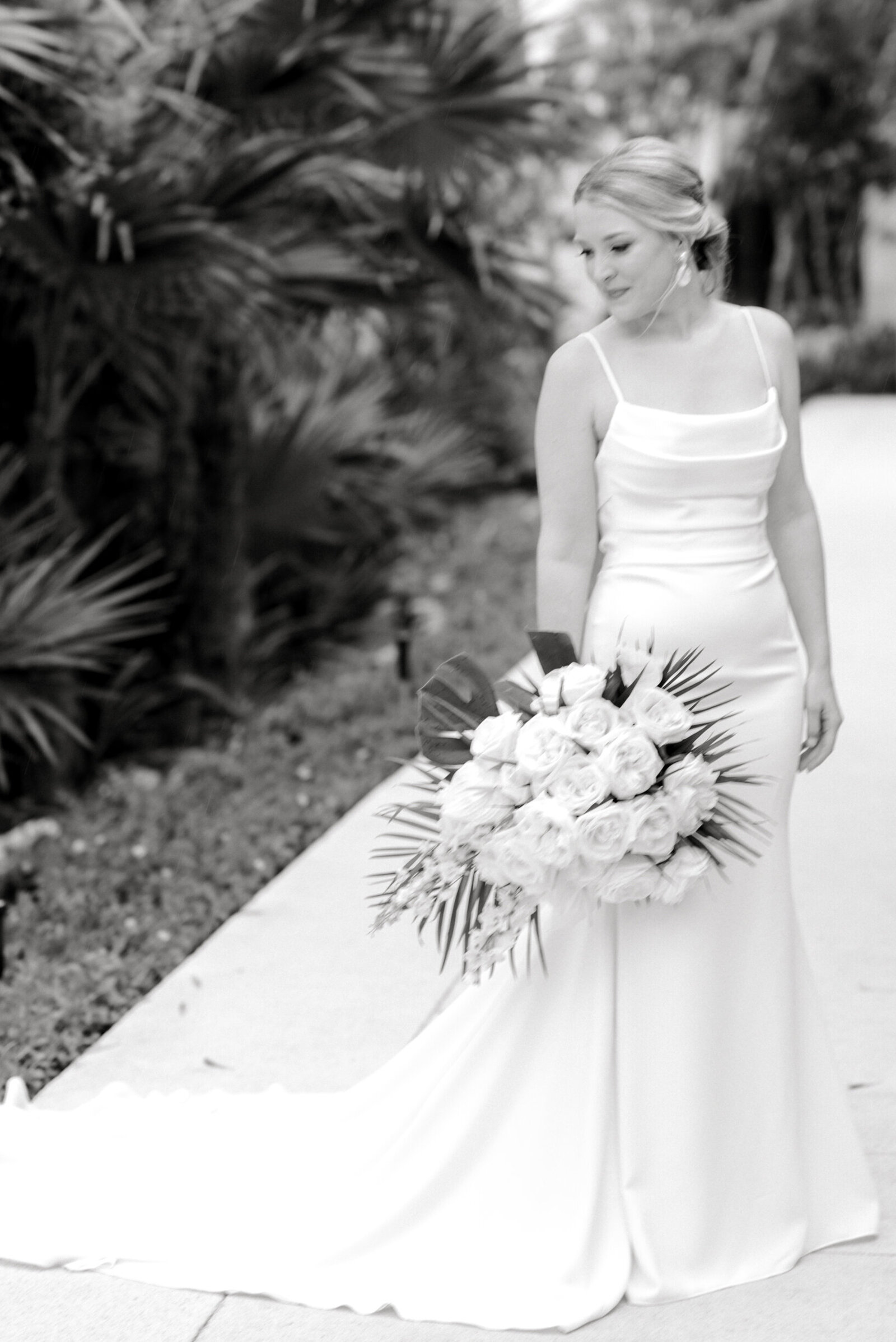 outdoor beach wedding bride posing with bouquet