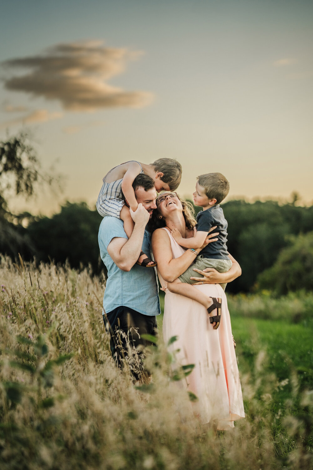 couple holds sons during boston maternity photos