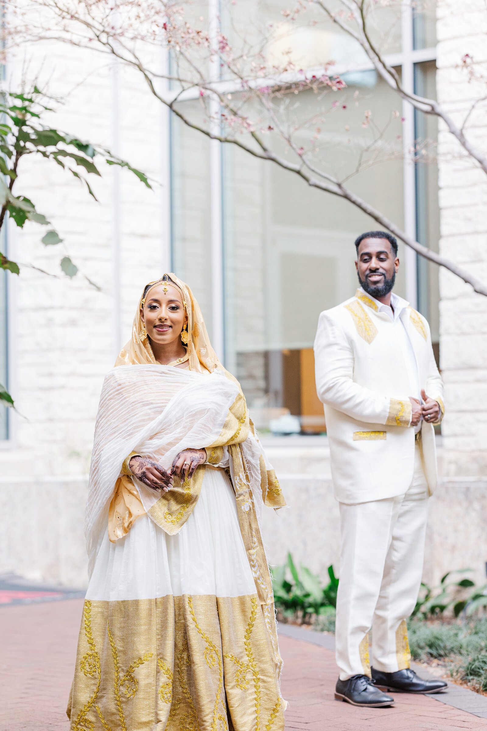 Groom-looking-at-bride-from-back-smiling