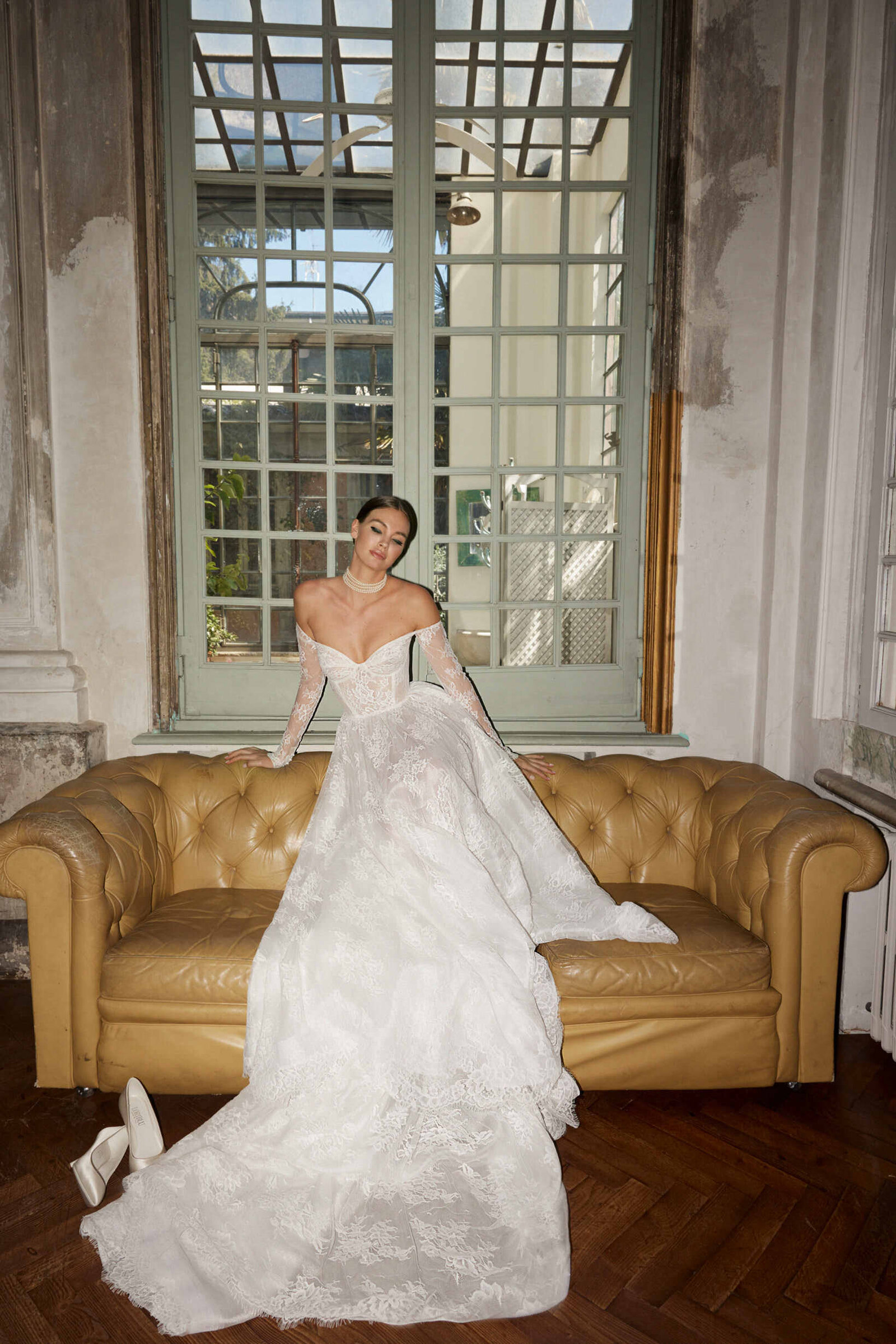 bride wearing white lace wedding dress with long train
