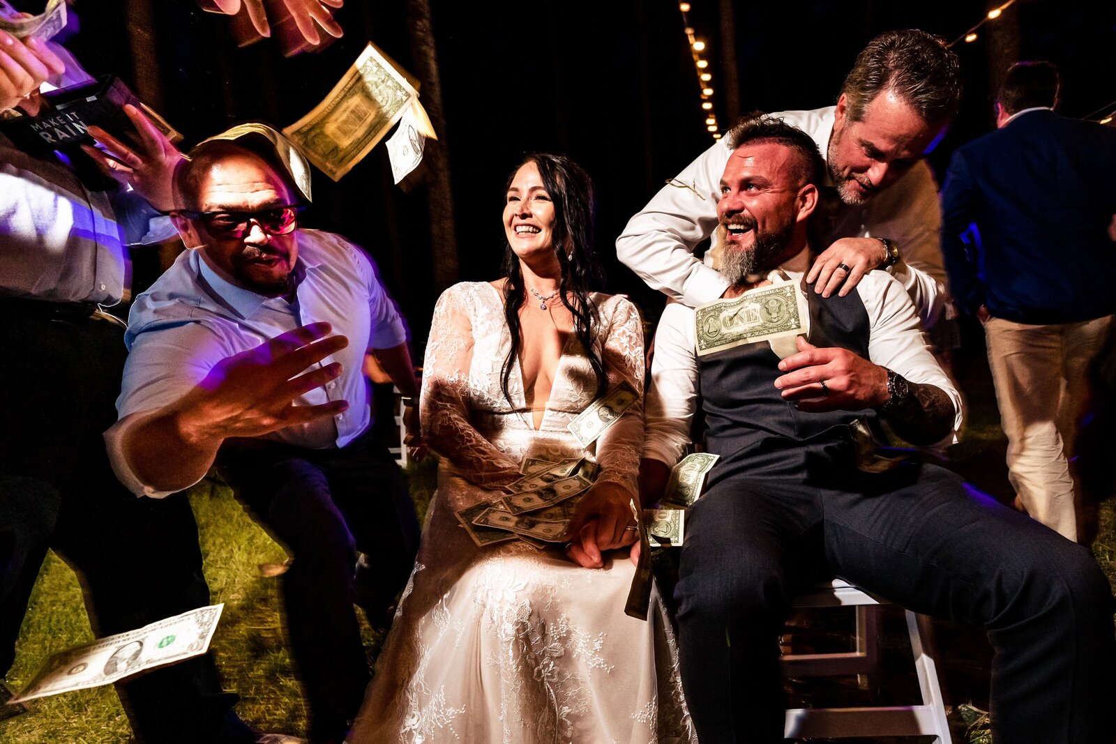 friends of the wedding couple throw money at them