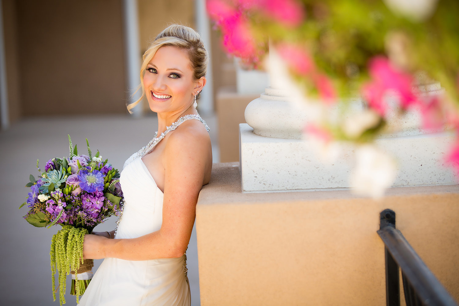 beautiful bride with purple and blue flowers