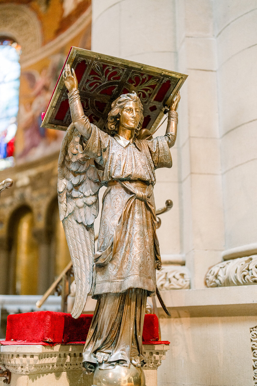 A detailed shot of an angel sculpture inside Stanford Memorial Church, highlighting the exquisite artistry and spiritual ambiance.