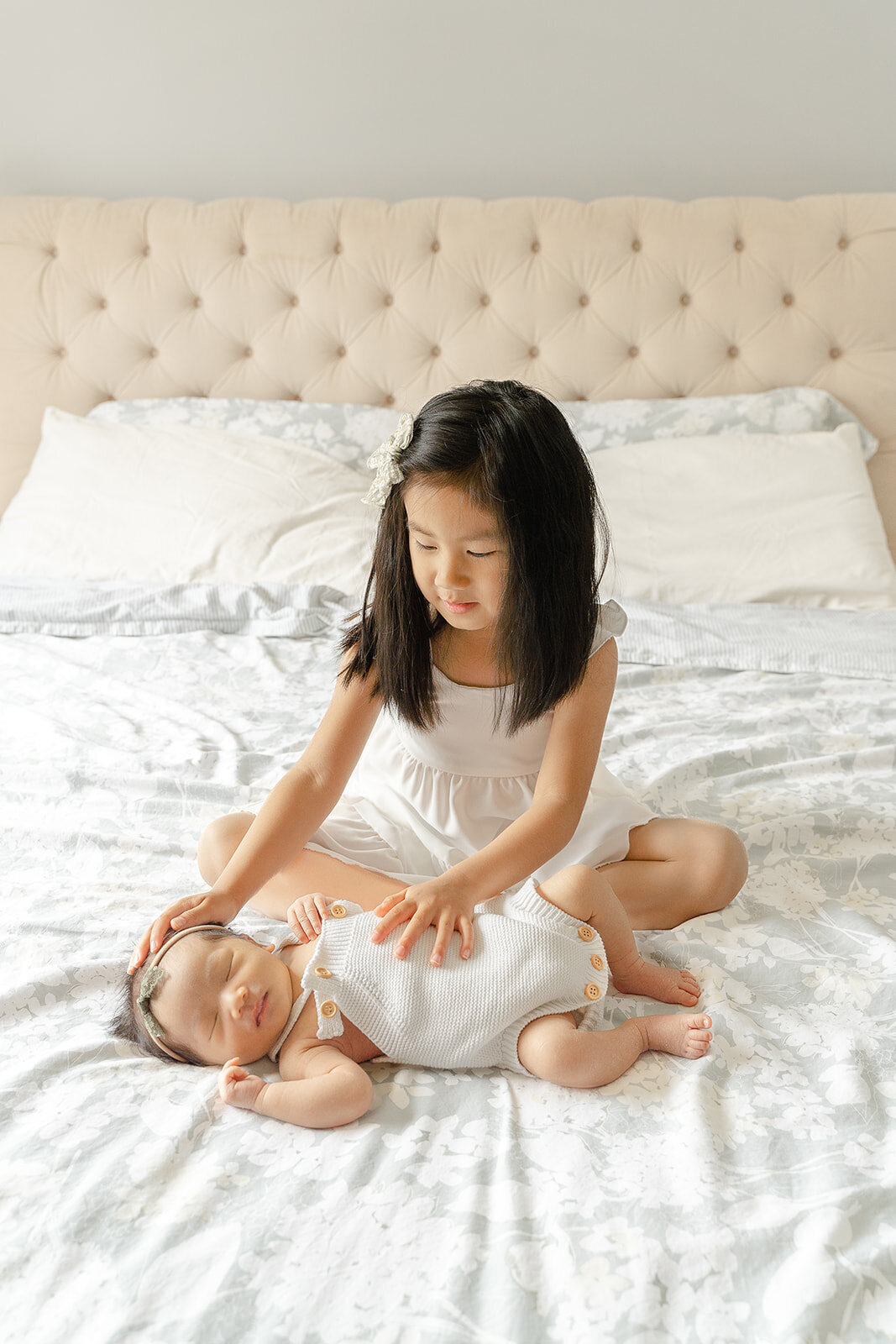 big sister touching baby during Leesburg, Virginia newborn picture