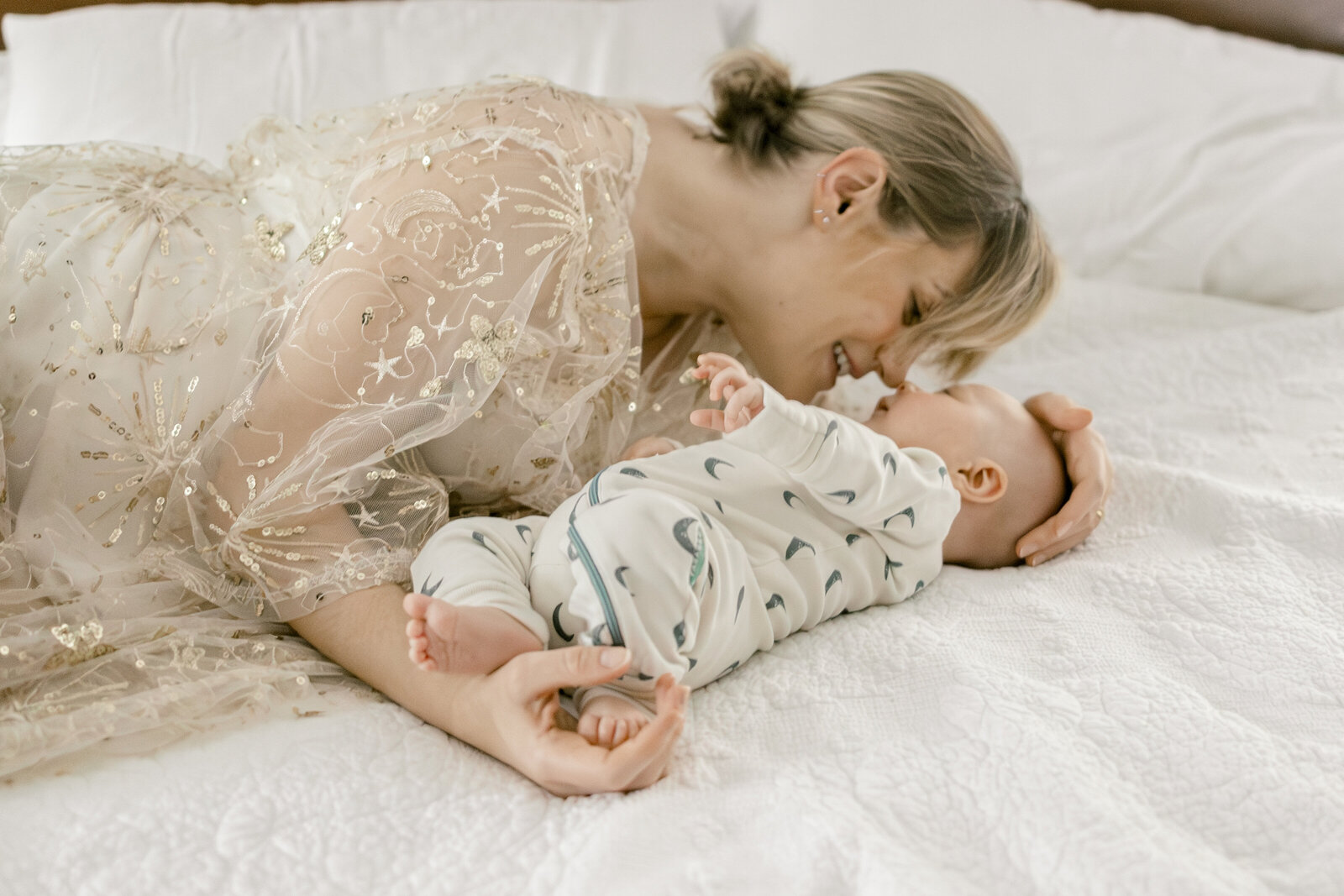 Mom snuggling with new baby