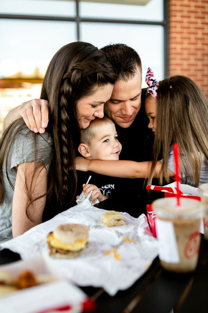 Des moines family eating Chic-fil-a together