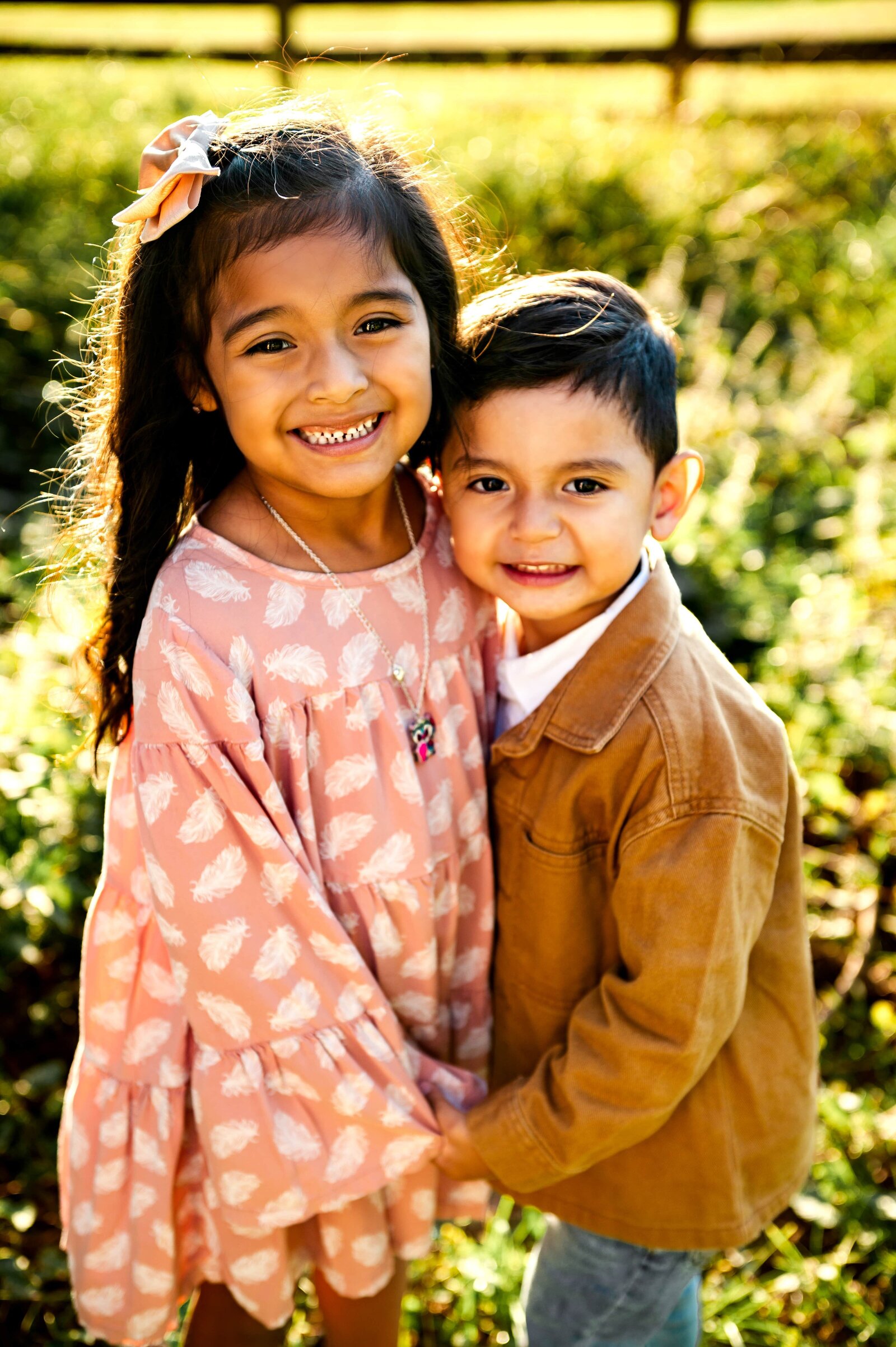 brother and sister holding hands smiling in Monkton, Maryland for a family photography session