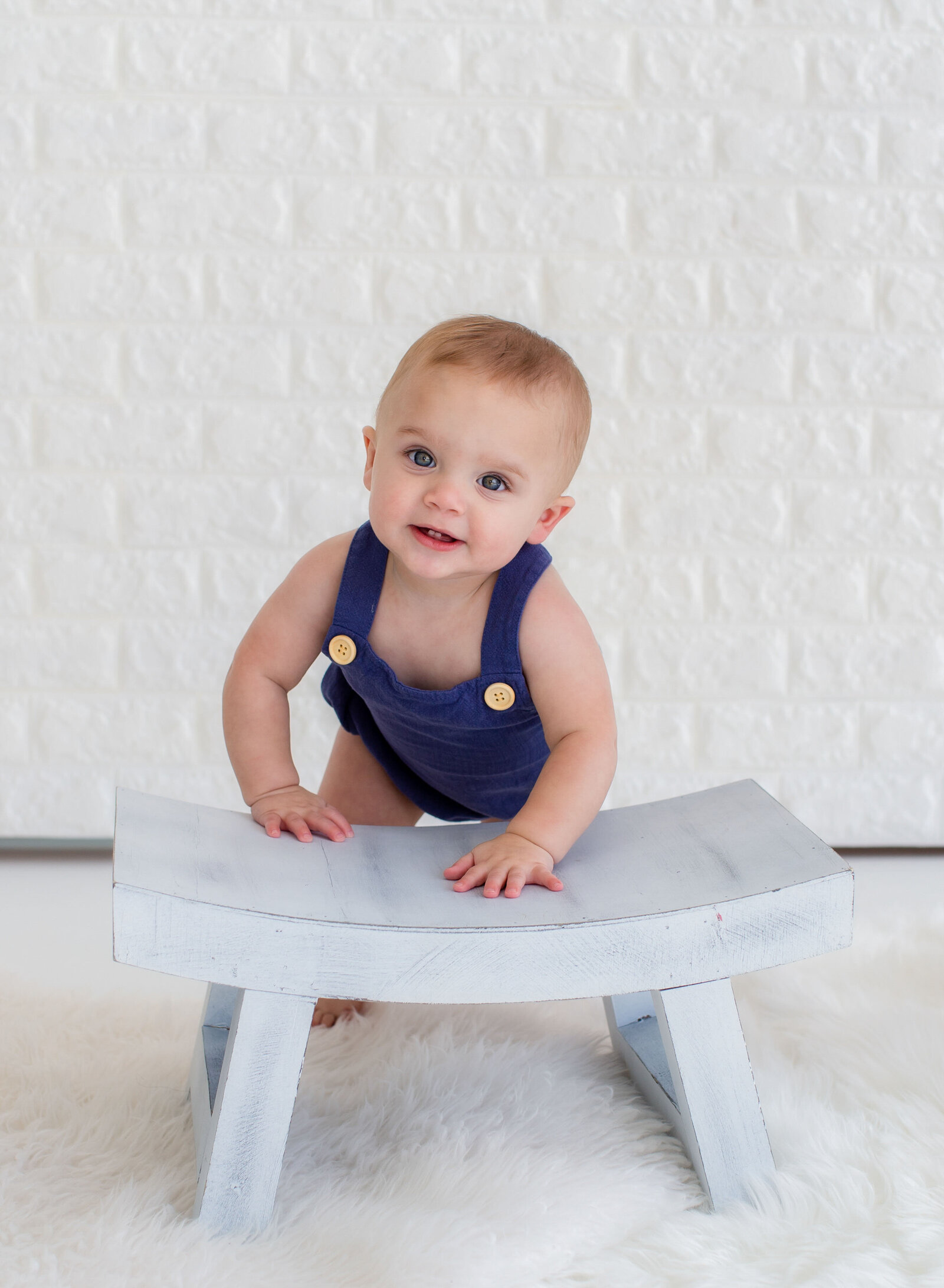 one year old boy smiling