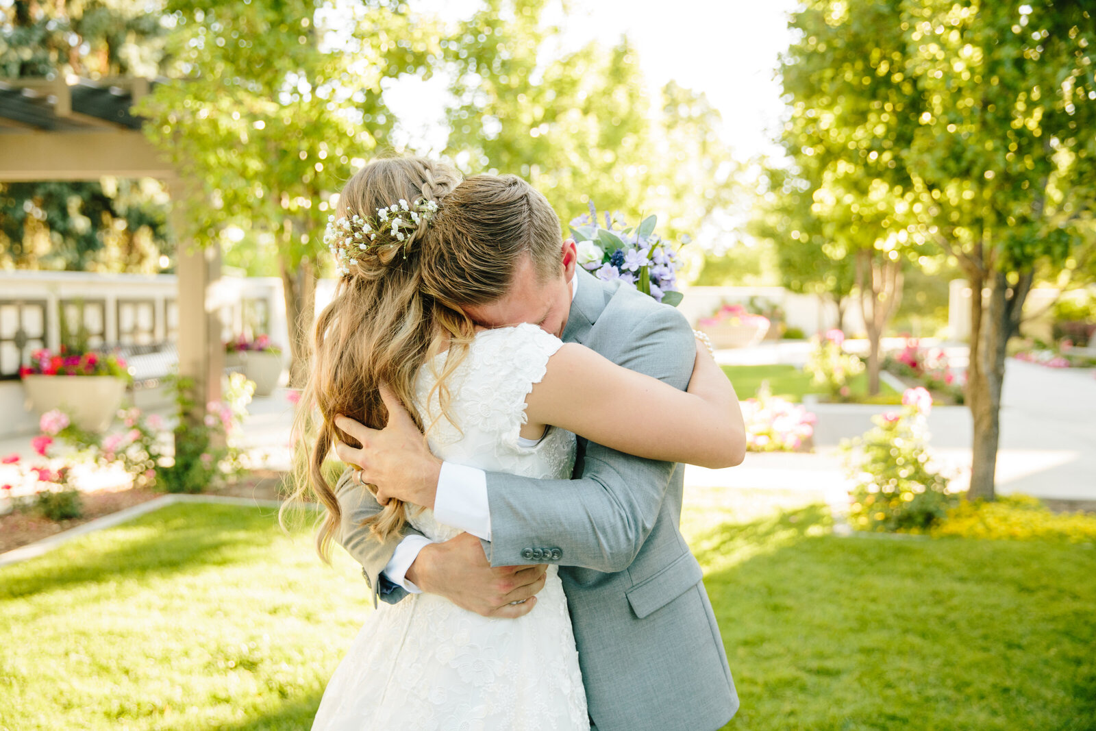 Jackson Hole photographers capture outdoor wedding of couple hugging after first look in Jackson Hole wedding