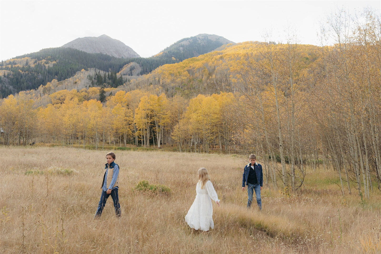 Authentic candid family photography in Aspen — child’s playful moment styled in elevated mountain fashion.
