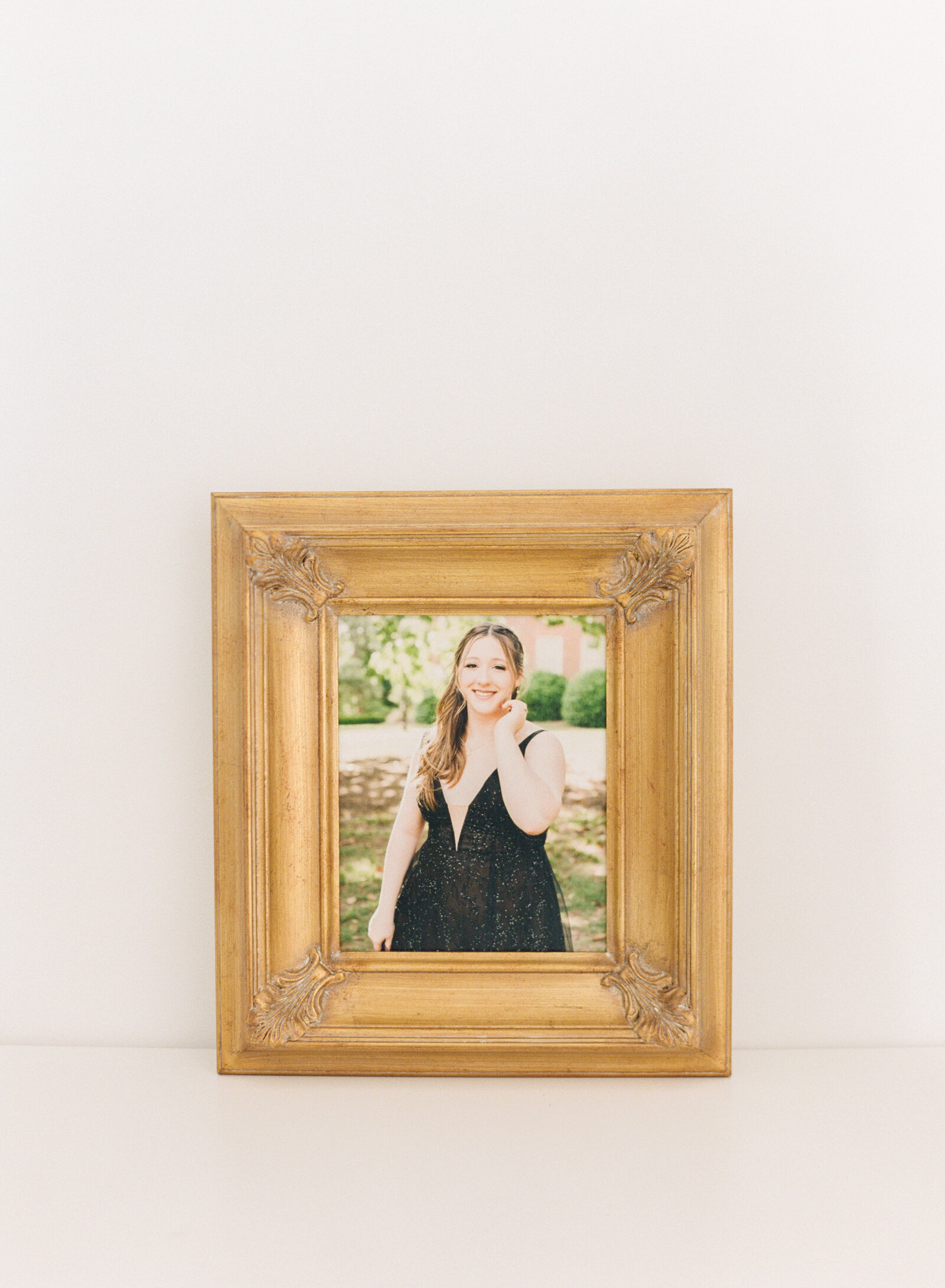 gold framed canvas from a Raleigh NC high school senior portrait session. Photographed by Raleigh family photographers A.J. Dunlap Photography.