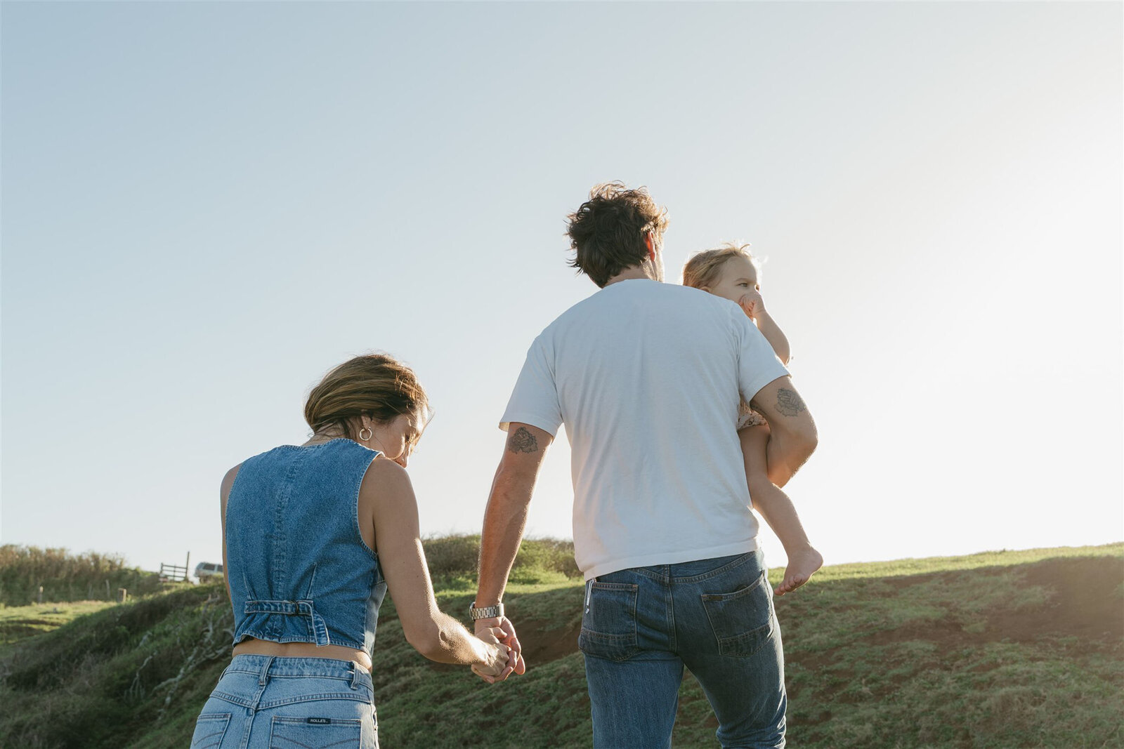 Golden Hour Maui family photo shoot, natural light highlighting denim and soft neutrals.
