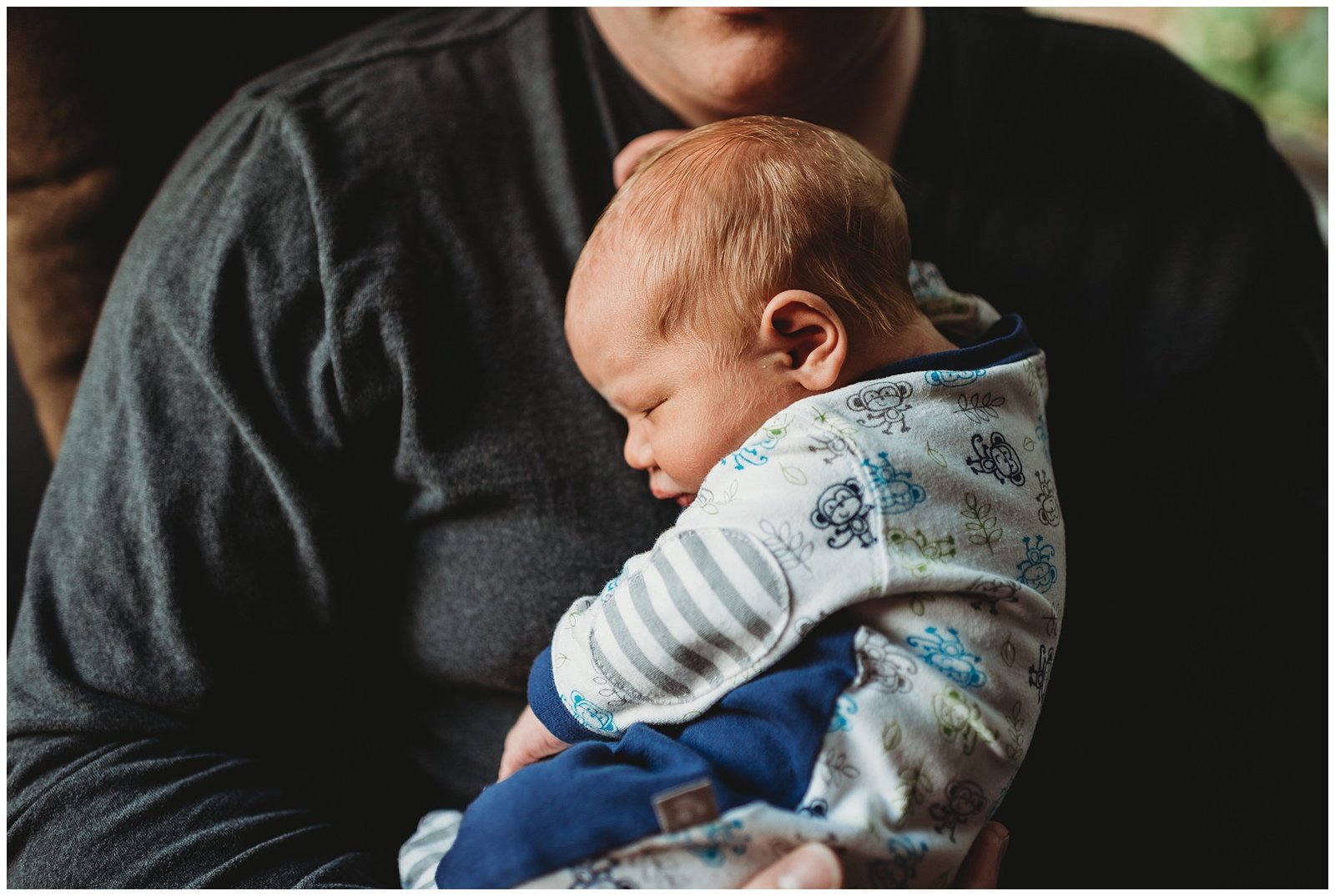 newborn baby boy curled up on dads chest Emily Ann Photography Seattle Photographer