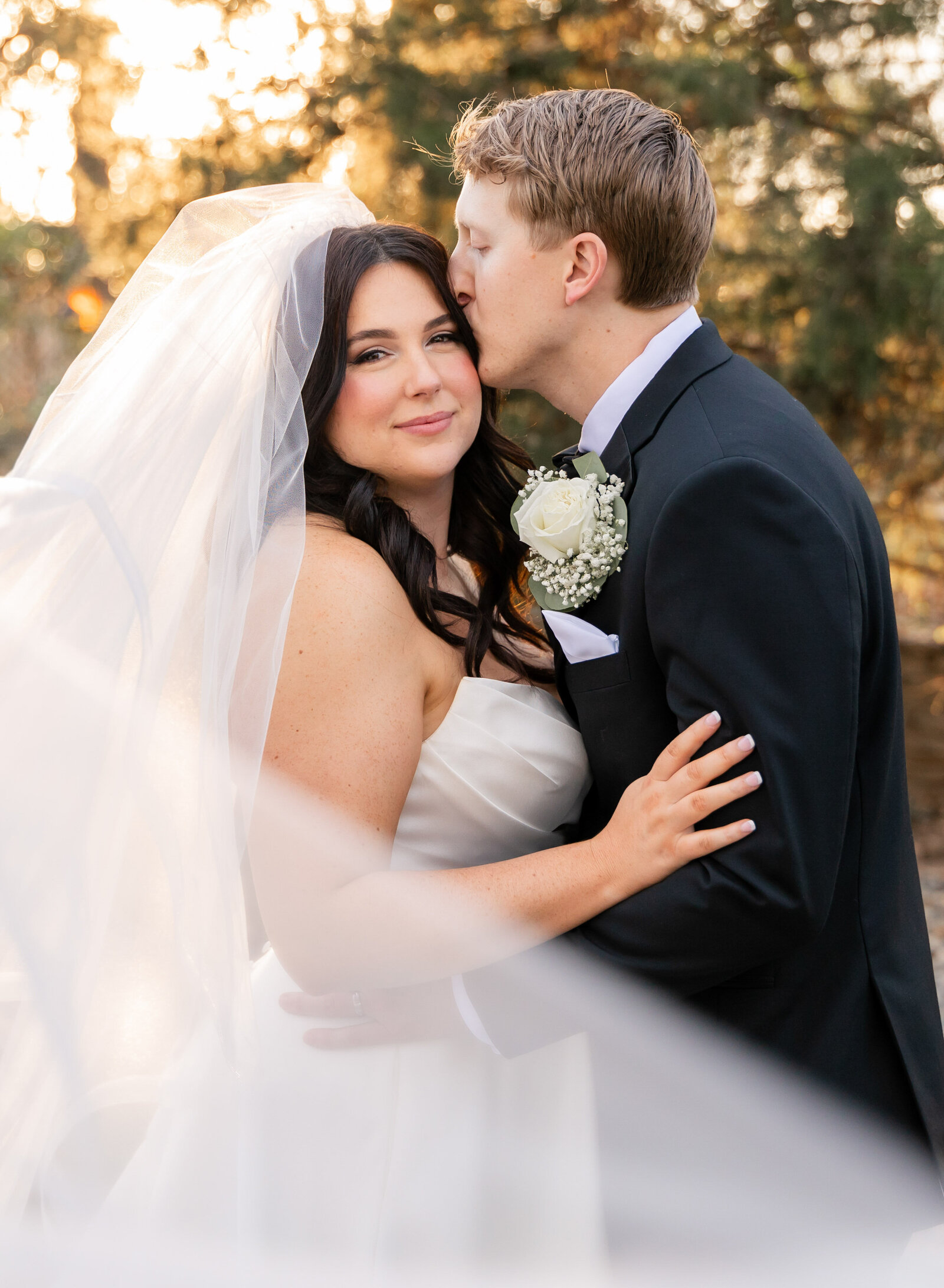 groom kissing bride
