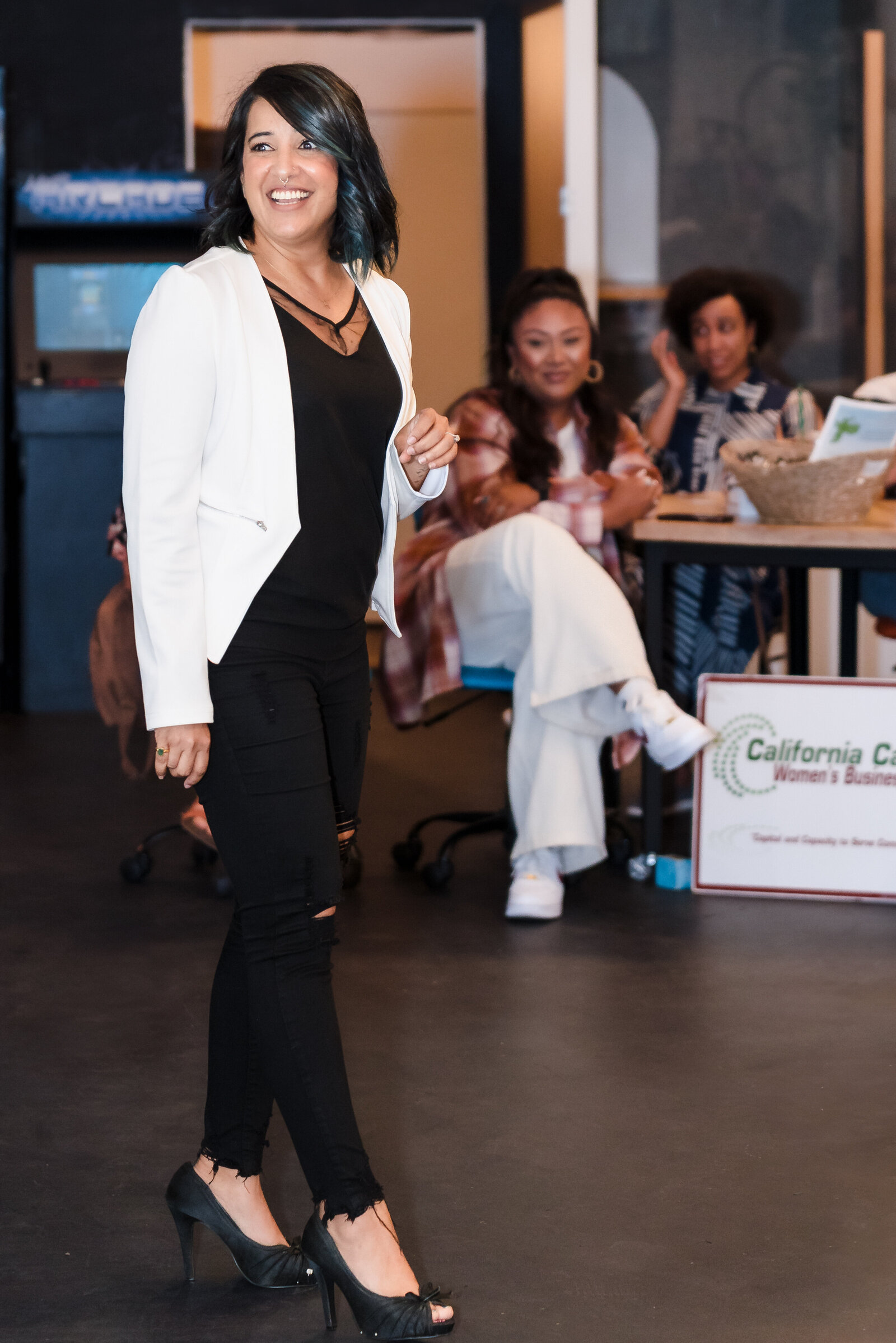 public speaker in action speaking to women in business
