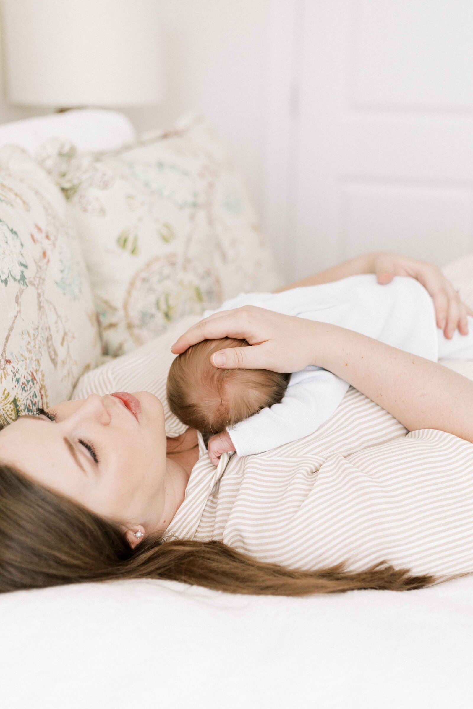 baby laying on mom's chest in newborn photos in peoria illinois