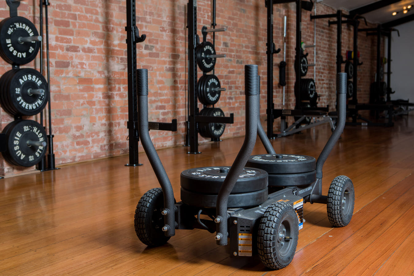 Weights on wooden floor at Collingwood gym.