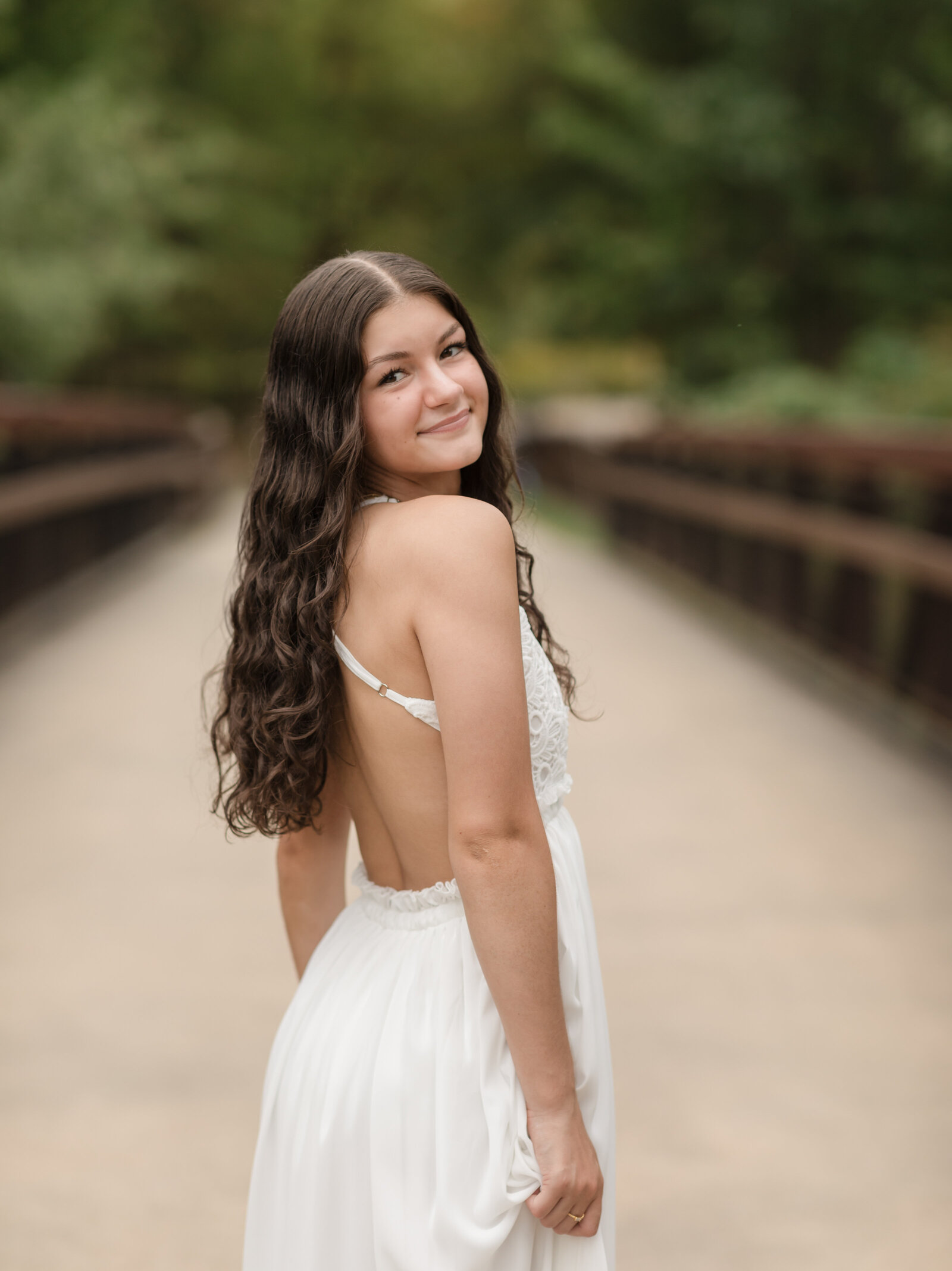 high school senior girl in white dress at park for senior portraits cleveland senior photographer