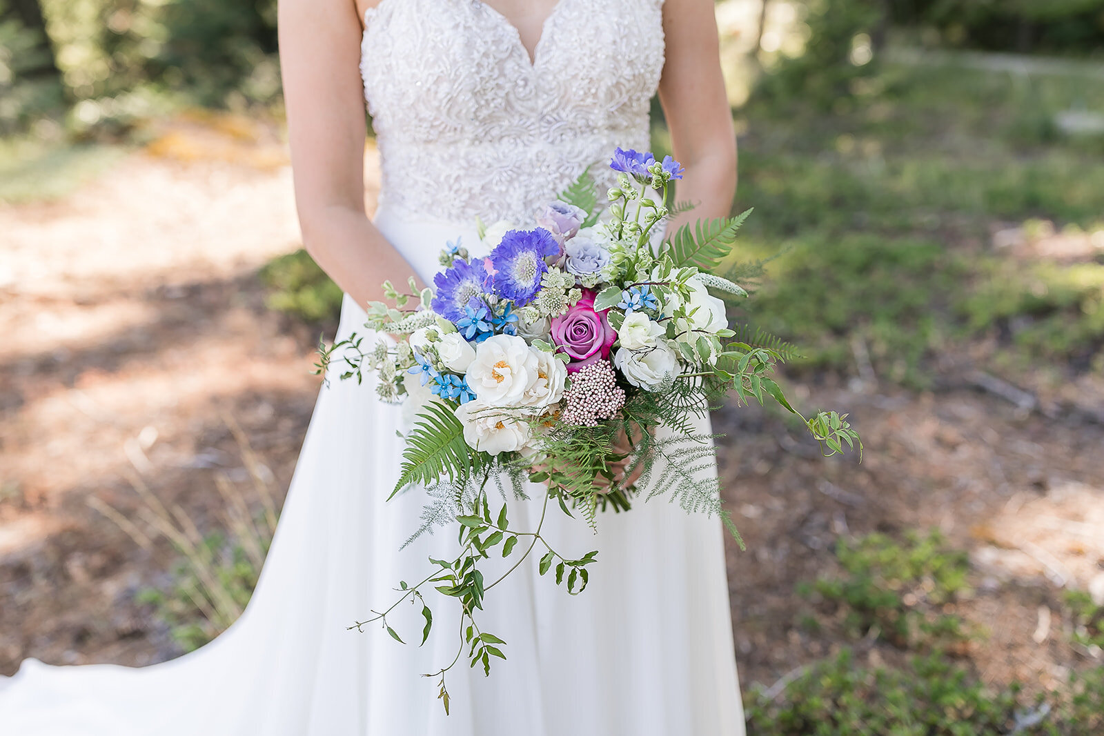 Pastel bridal bouquet by Flowers and Thyme representing an example of floral design in the florist portfolio.