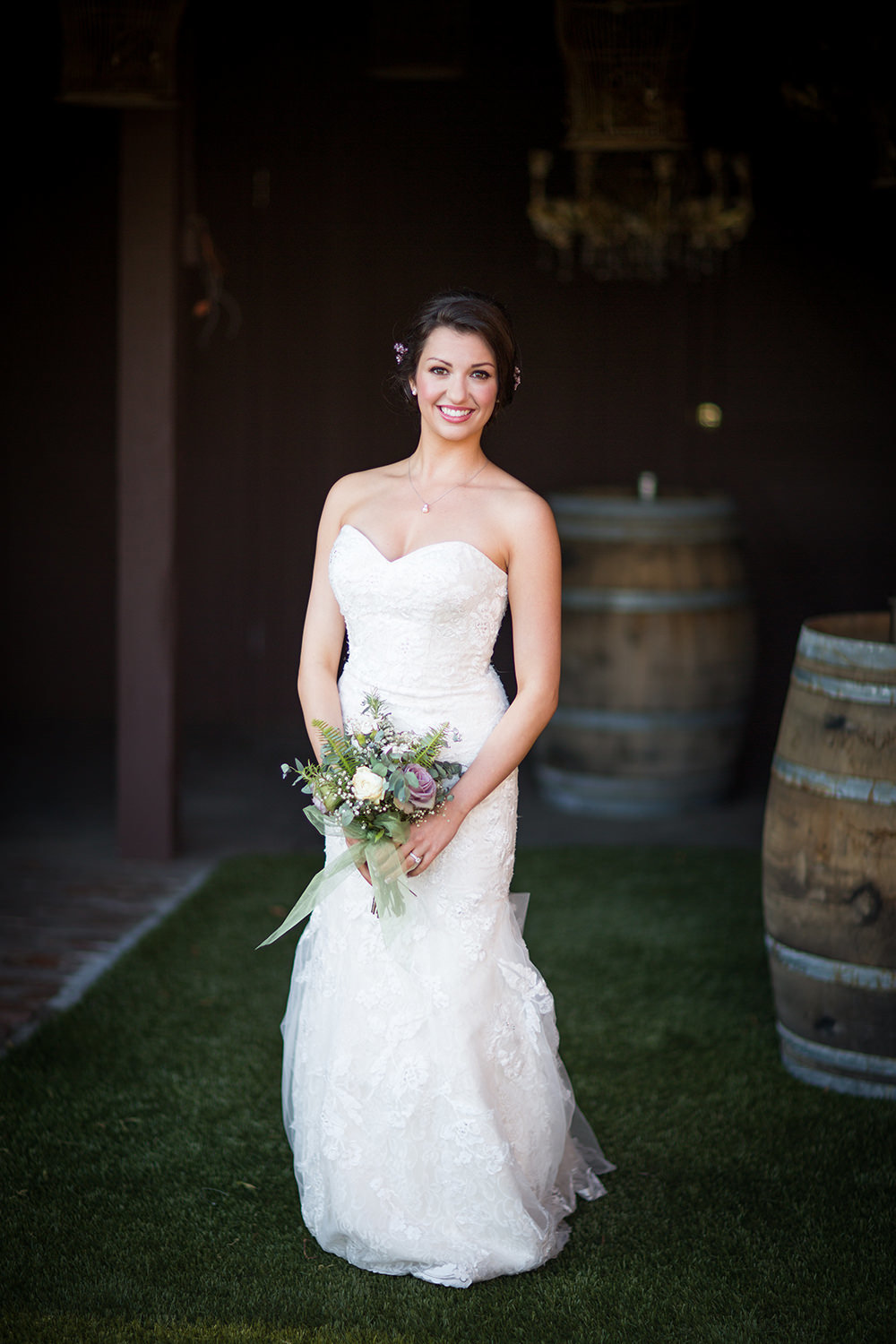 bride with wine barrels