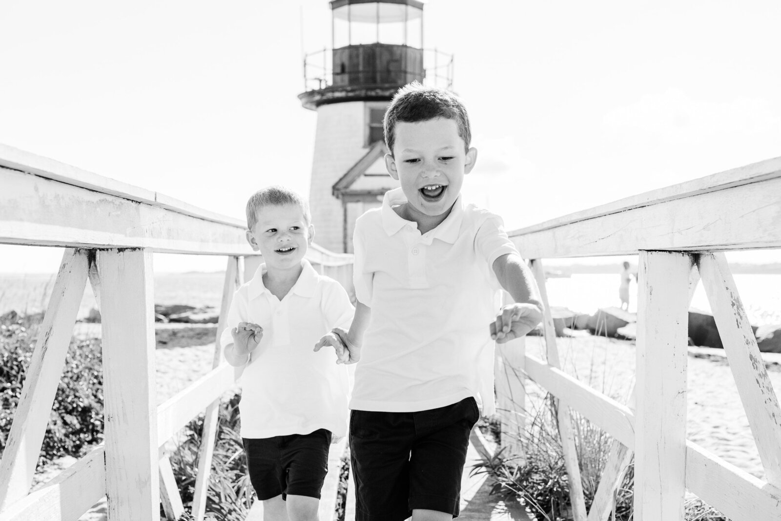 brothers running at lighthouse