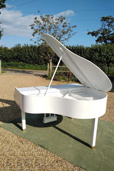 semigrand white baby grand piano shell outside