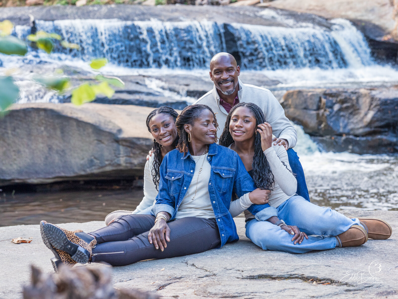 running river and family on rock