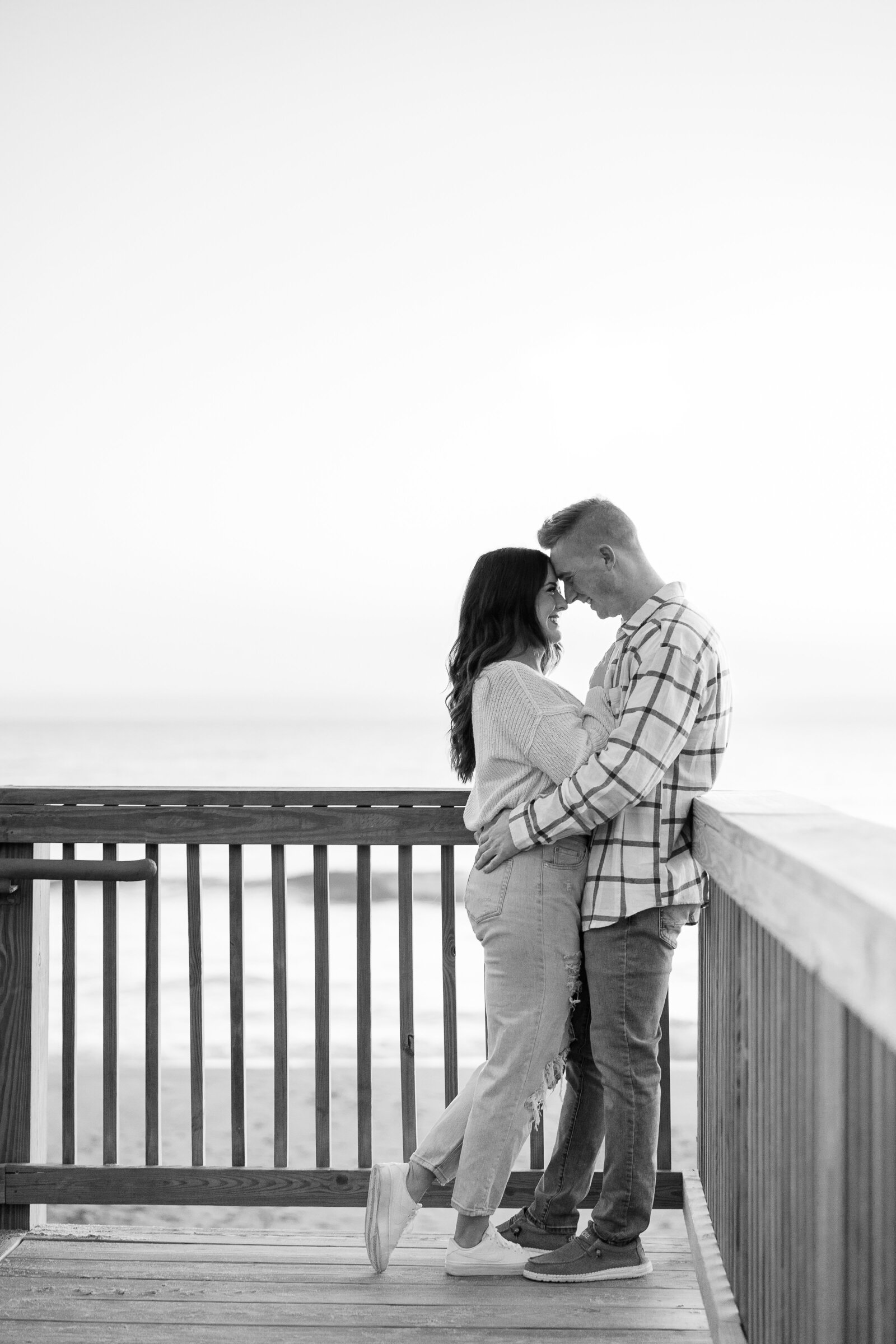 black and white image of couples beach engagement session