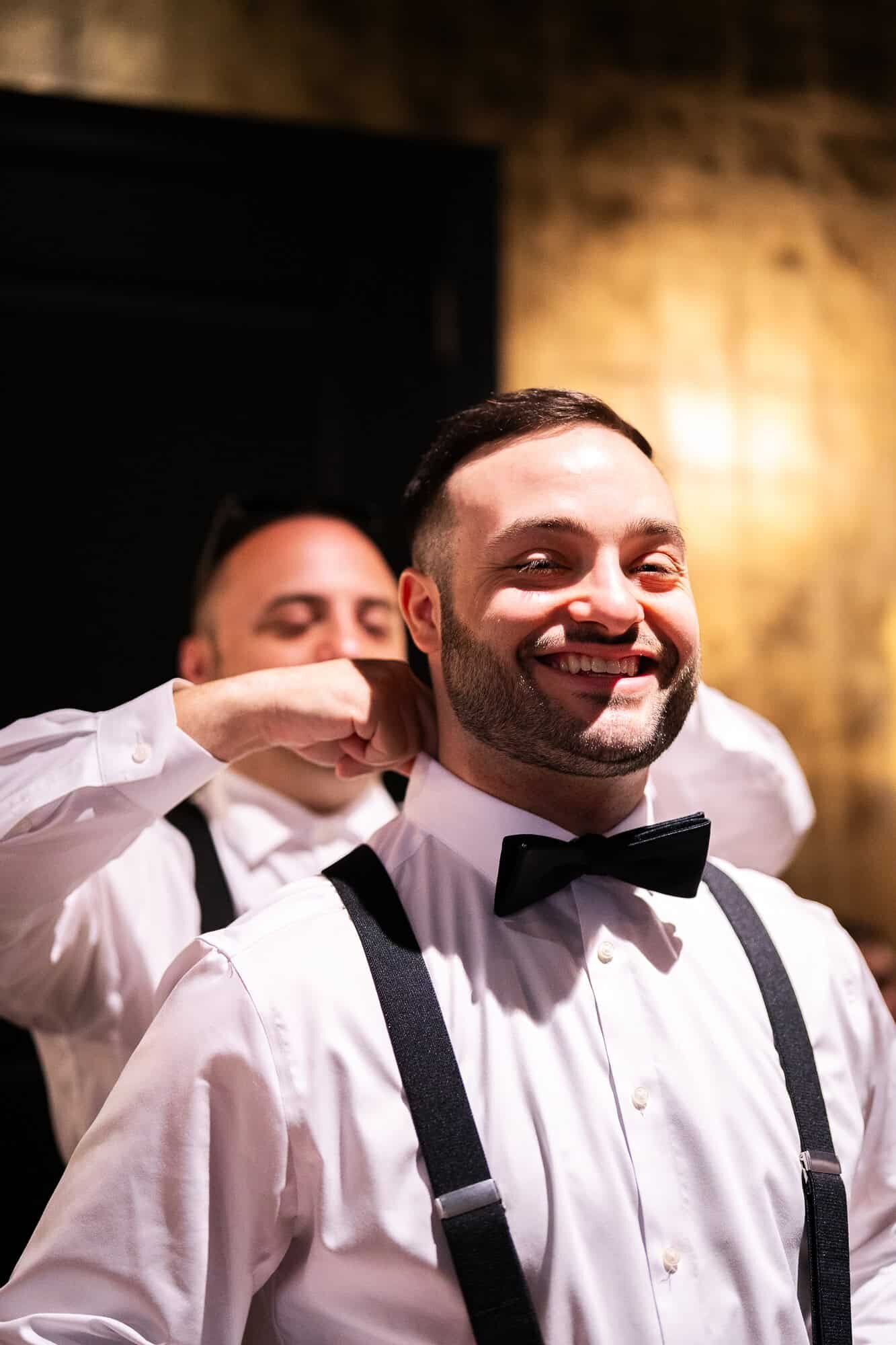 groom getting ready for his wedding at Casa Monica