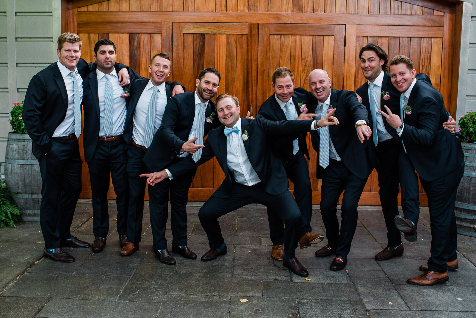 groom and groomsmen playful formal 
