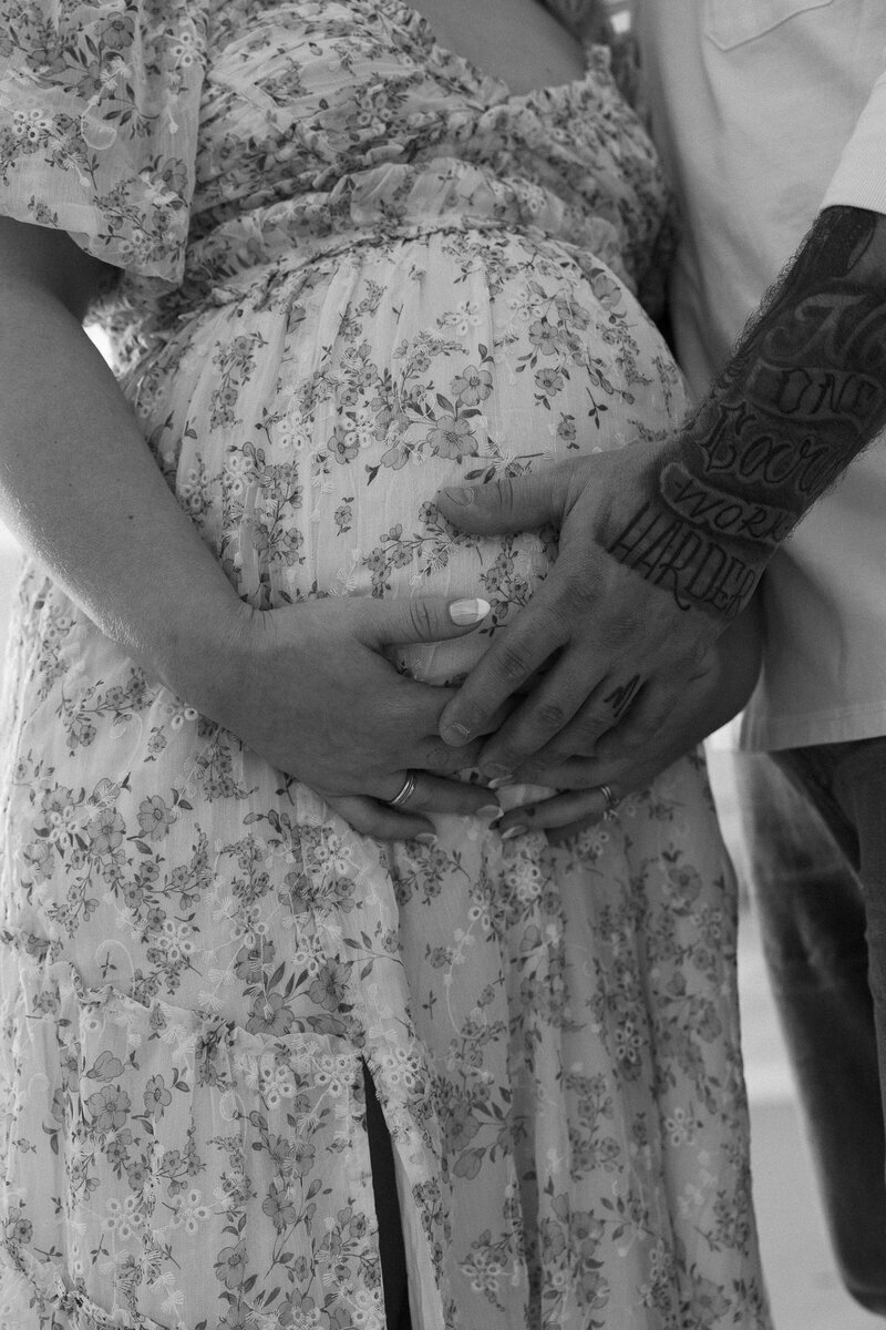 expecting mom holding pregnant belly taken by family photographer naples fl
