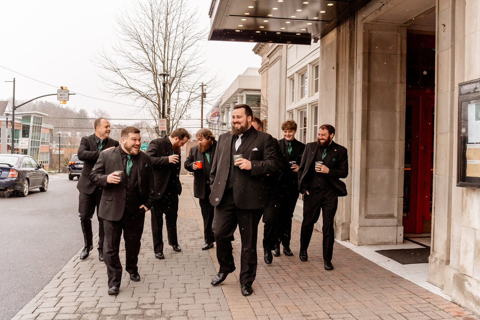 Groom strolls in front of Hotel Morgan with his best buds before getting married.