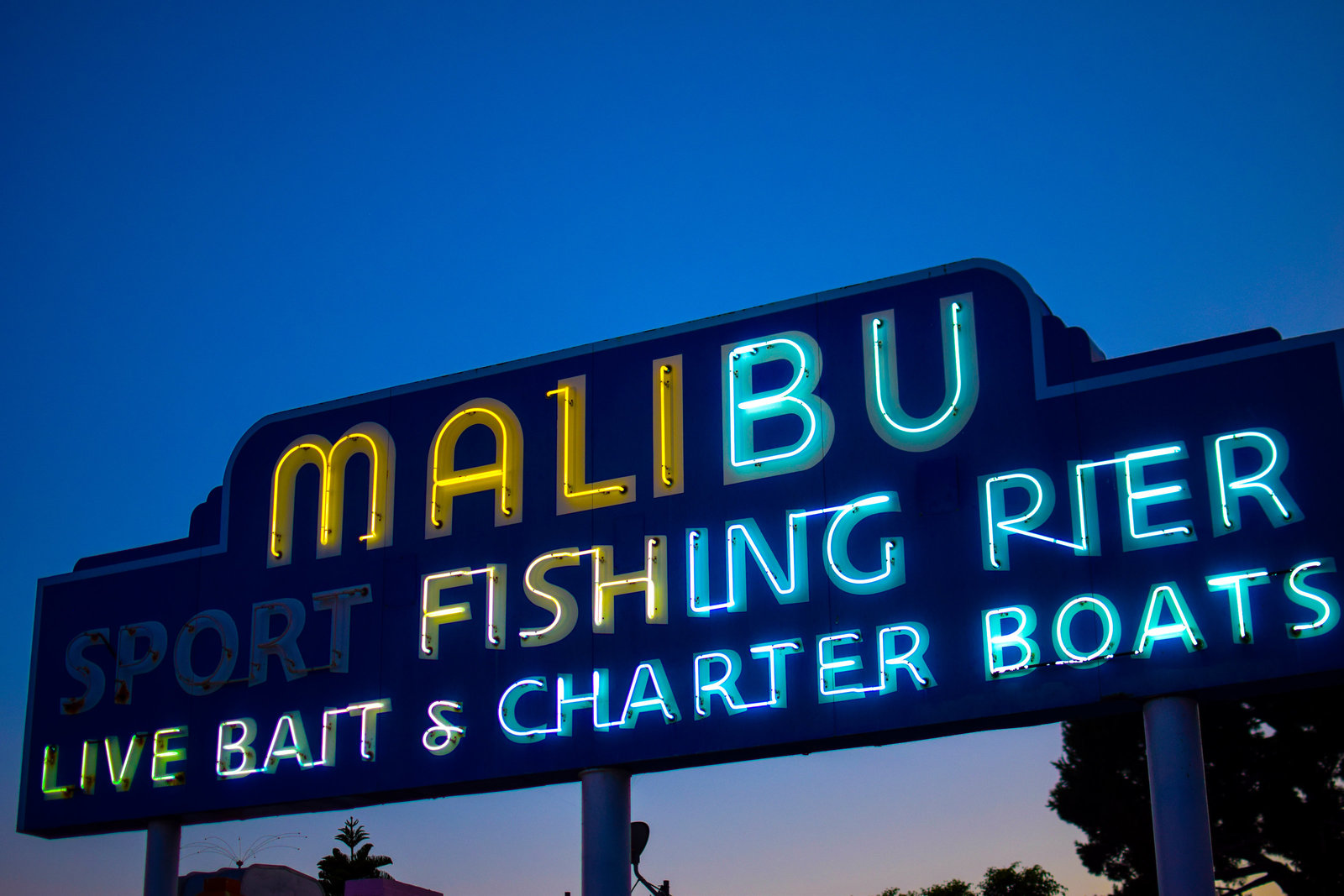 Fishing pier at night neon Malibu California