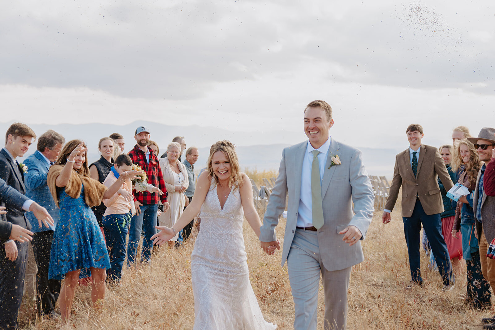 Your wyoming wedding packages with couple's photography as groom wraps arm around his bride