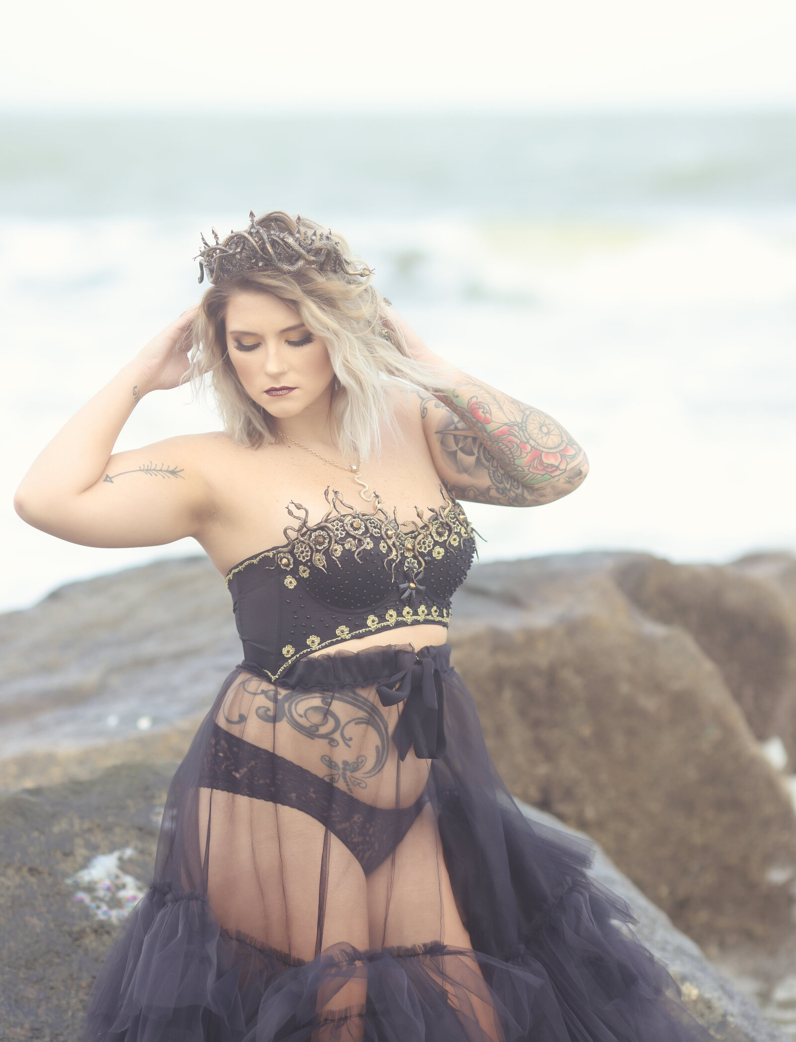 Woman on beach with Medusa crown and skirt