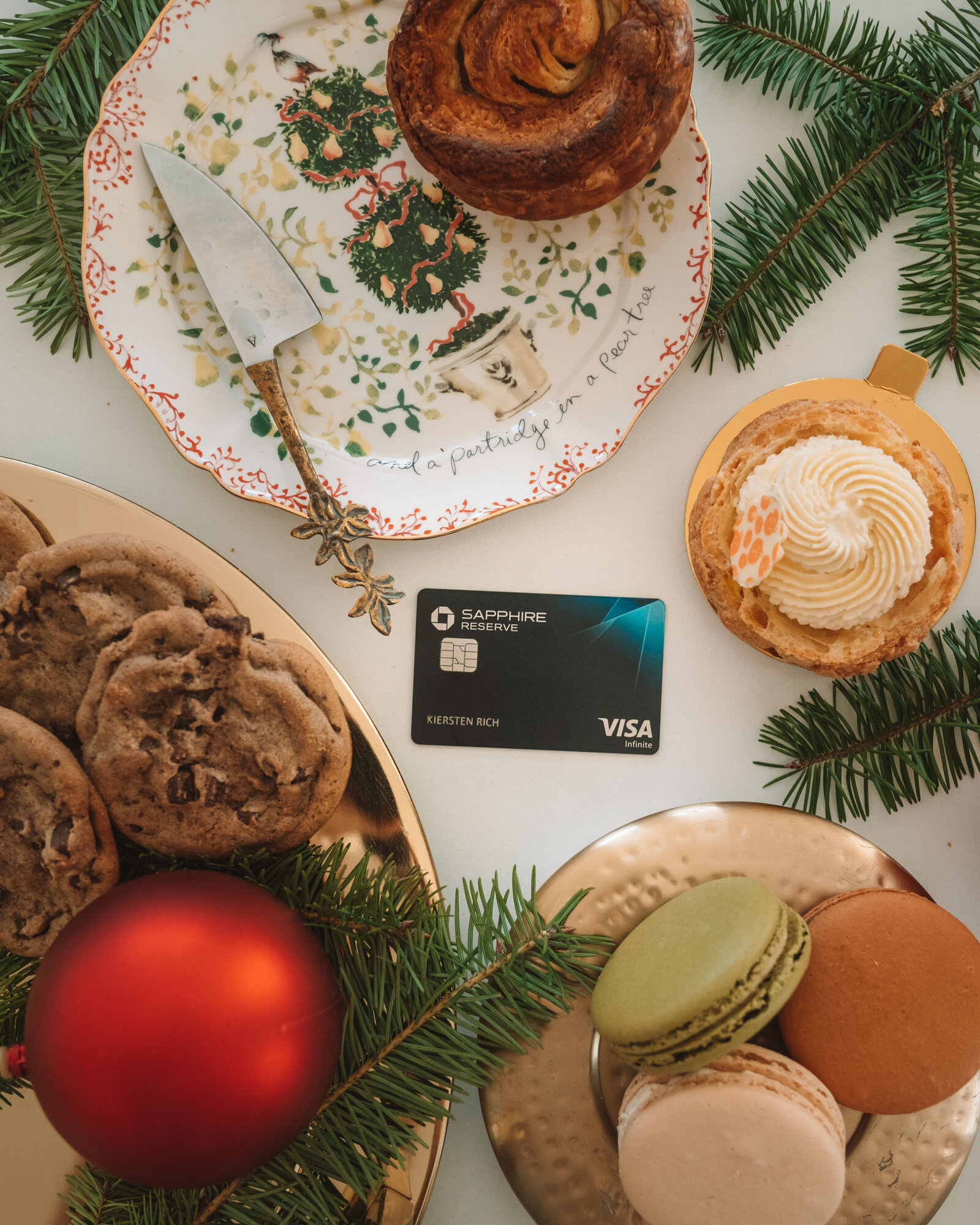 Chase Sapphire travel credit card flat lay Christmas desserts macarons. Styled holiday flat lay by product photographer Chelsea Loren.