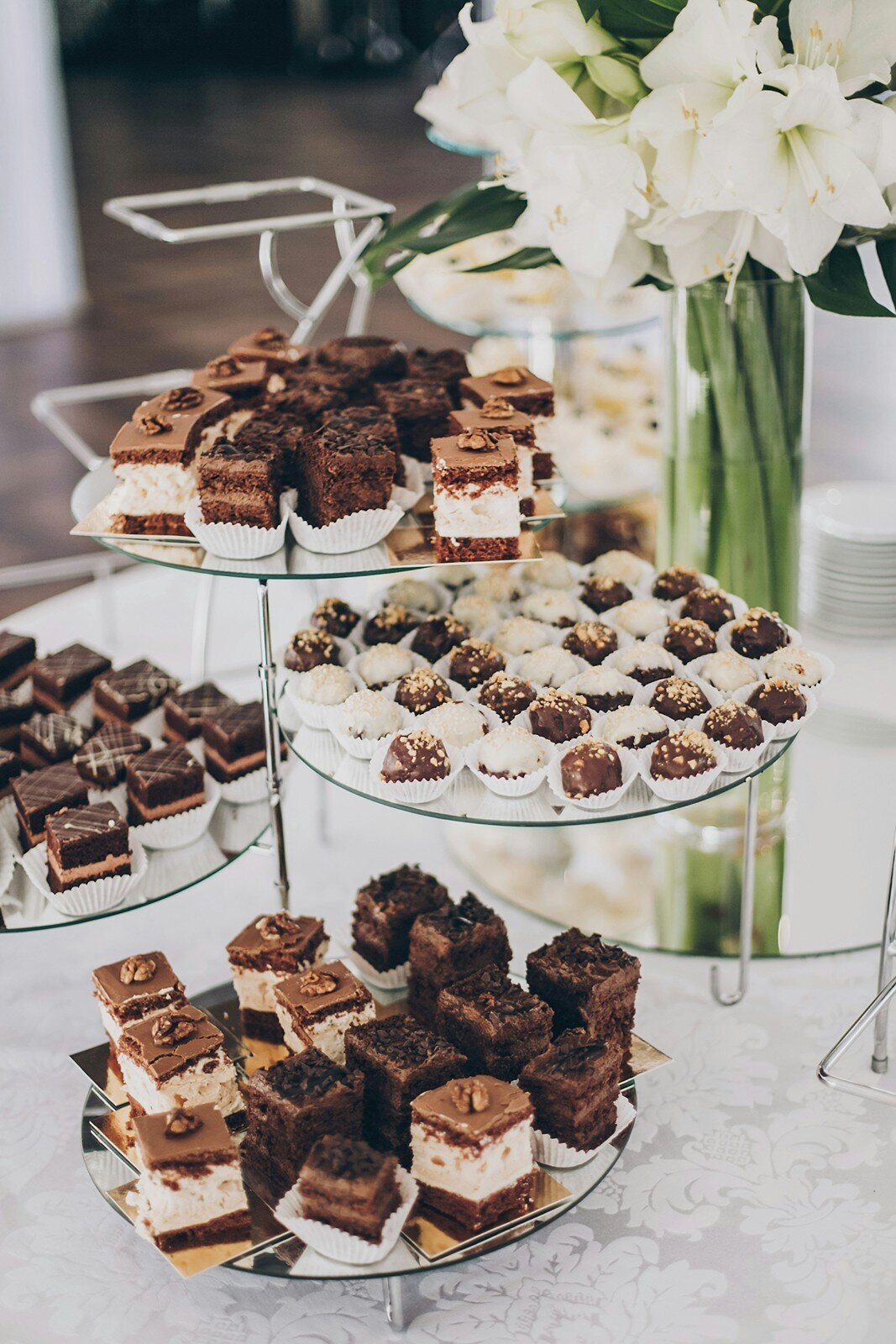 Tiered dessert stand with chocolate treats and truffles