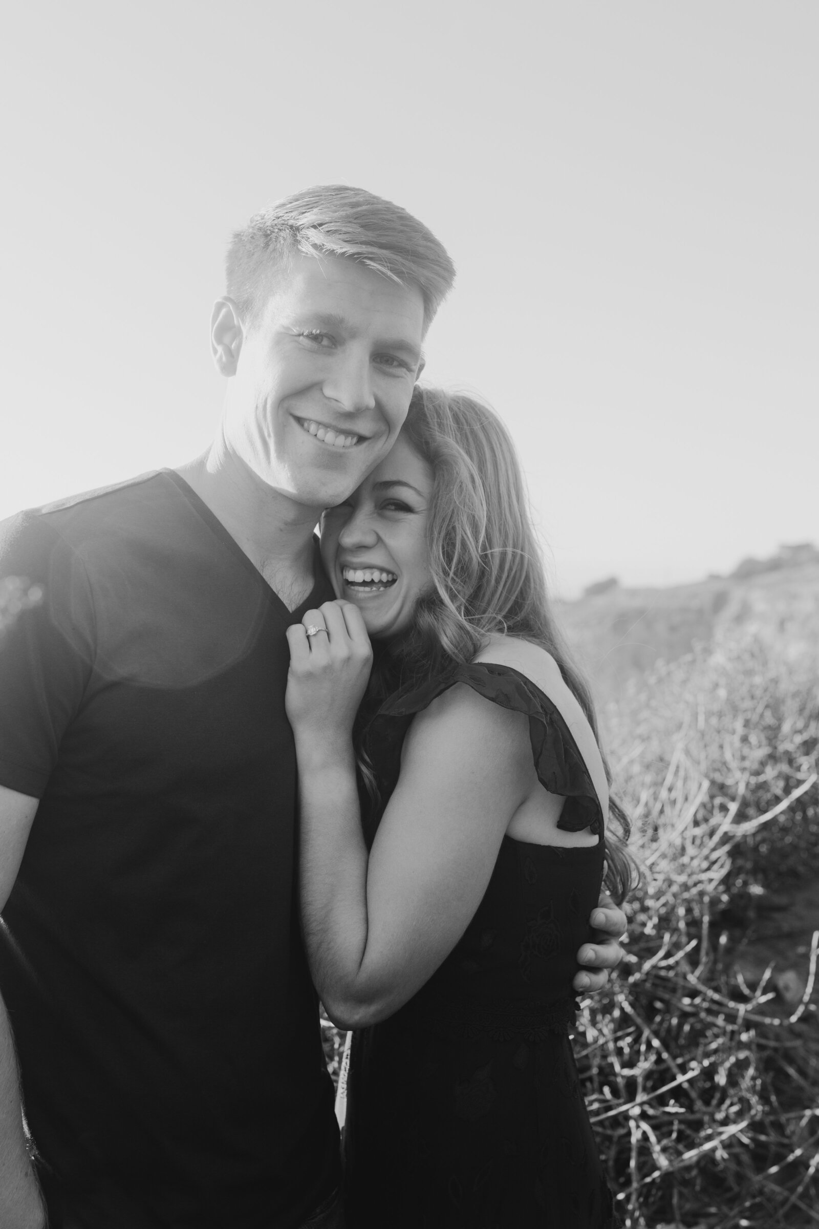 A couple poses for their engagement photos in Big Sur, California.