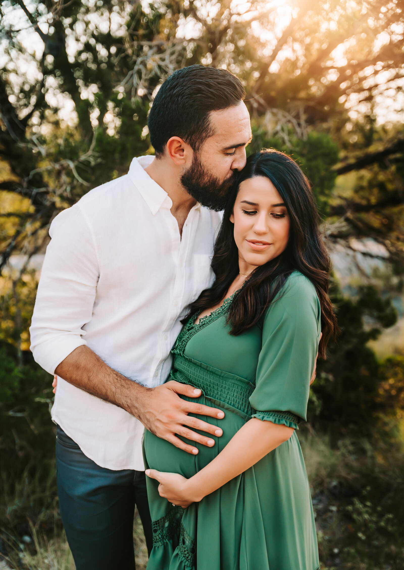 Maternity Photographer, a man and his expectant wife embrace outside