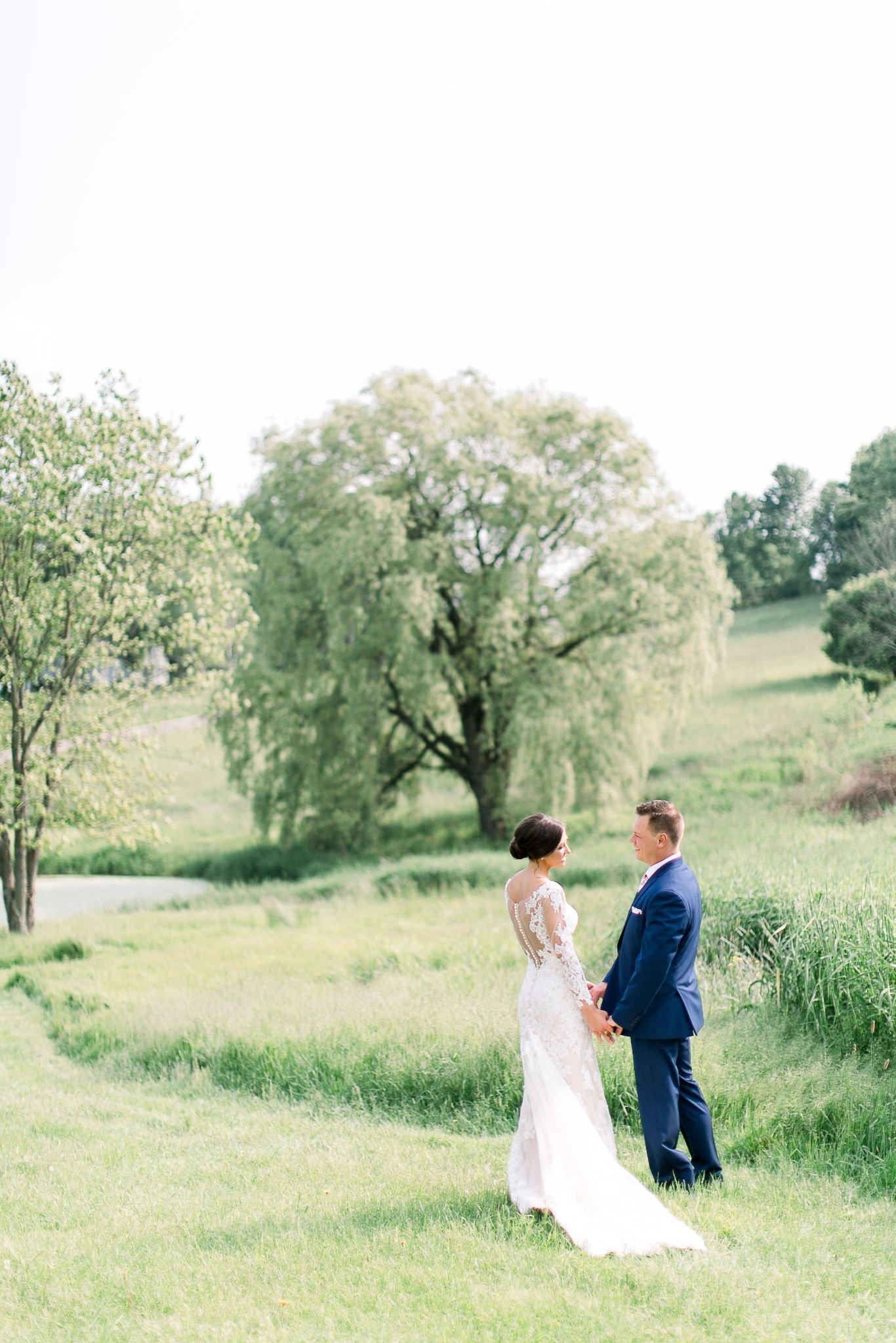 Bride and groom in a field during an outdoor Maine wedding