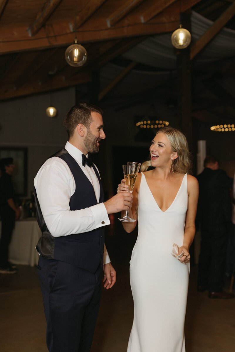 Bride and groom smiling at each other by washington adventure elopement photographer
